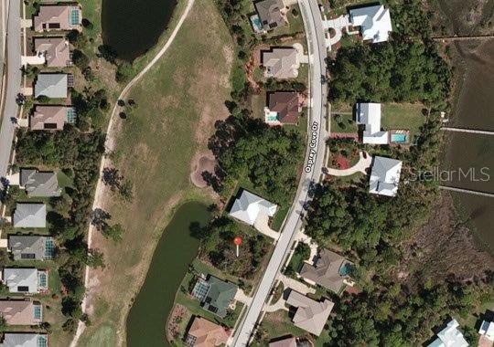 Lakefront and golf course views from this homes site in gated community just a few lots from end of cul-de-sac.  Quiet and serene location with beautiful homes nearby.; Cleared: No