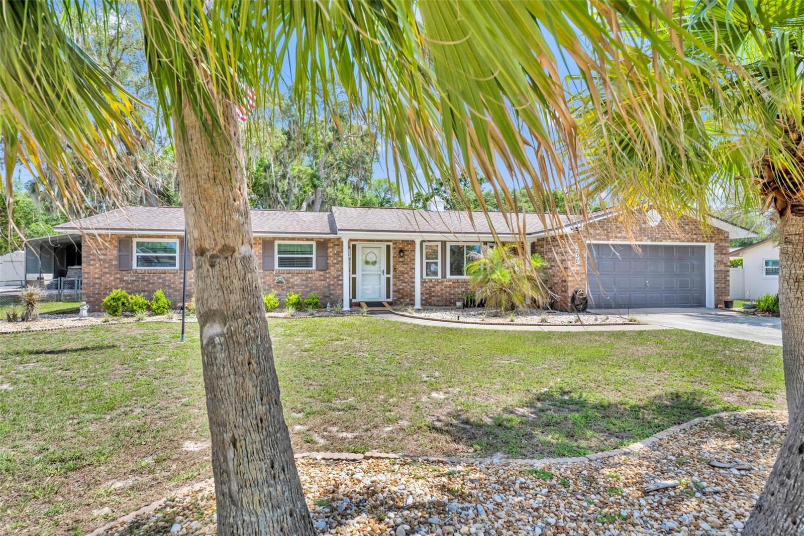 Under contract-accepting backup offers. Nestled in the subdivision of Country Club View, this charming 3-bedroom, 2-bath home could be yours. Situated on approximately 1/3 of an acre, the property offers beautiful views of majestic oak trees, best enjoyed from the relaxing Florida room while sipping your morning coffee or unwinding with a good book. Inside, this inviting home features both a spacious living room and a comfortable family room, along with a separate formal dining room perfect for entertaining. Don’t miss the opportunity to make this beautiful property your next home — schedule your showing today!