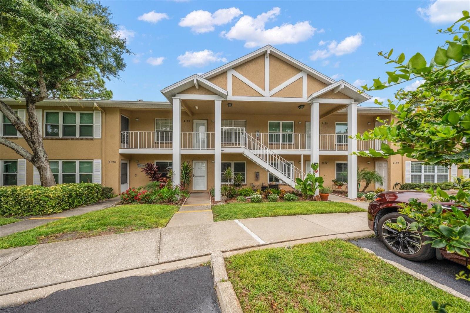 Discover the ease of condo living!  This ground-floor unit offers peaceful pond and park views, with a tranquil natural backdrop of walking trails, water features, and local wildlife in your back yard. Located in the desirable St. Andrew’s Links community, this is a wonderful place to enjoy full-time living or escape harsh northern winters. Surrounded by mature oak trees and ideally positioned next to the Dunedin Golf Club and Highland House Restaurant, the setting blends natural beauty with convenience. You’re just moments from the Pinellas Trail, Dunedin Community Center, Dunedin Fine Art Center, Highlander Pool, tennis courts, and more. Walk or bike to vibrant downtown Dunedin or take a short drive to the white sand beaches of Honeymoon Island State Park. Covered carport and plenty of guest parking even in the winter season. This friendly, active community offers a heated pool and regular social events, along with strong financials and no known assessments. No age restrictions and two small pets are welcome.