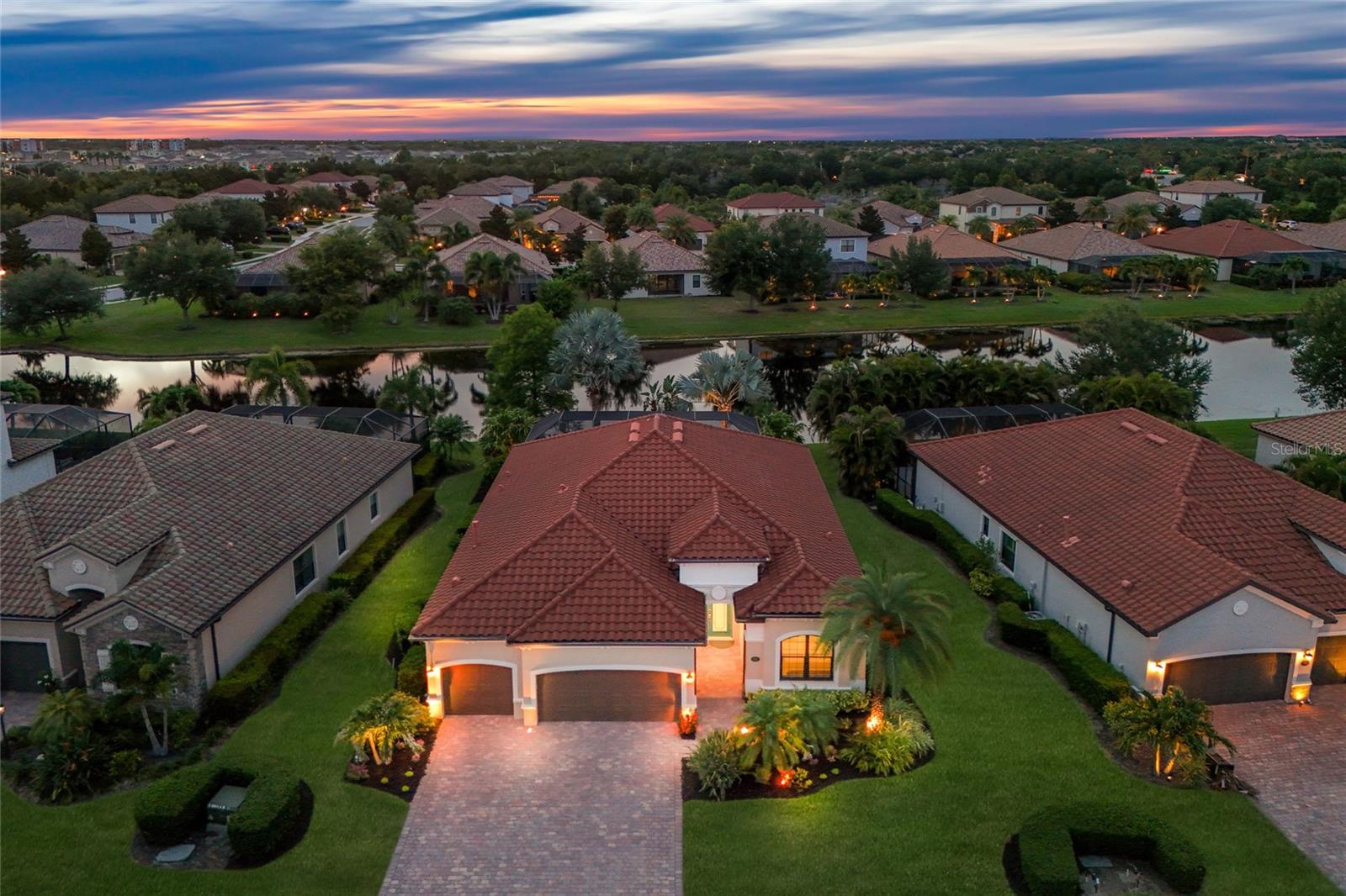 Located in the gated, lawn-maintenance-included community of Bridgewater at Lakewood Ranch, this 4-bedroom Princeton floor plan offers a 3-car garage, HURRICANE IMPACT GLASS WINDOWS, a 2023 HVAC system, no carpets, and a long list of meaningful upgrades inside and out. Major highlights include a FULLY REMODELED KITCHEN, custom family room TV wall with electric fireplace, and a pavered lanai with heated saltwater pool and spa, water view.

The remodeled kitchen features KitchenAid appliances including a 5-burner gas range with convection, convection microwave, and 27 cu. ft. refrigerator with icemaker, along with a Bosch dishwasher, Cambria Torquay quartz countertops, direct external exhaust range vent, Franke stainless steel sink, under-cabinet LED lighting, and all-new Shiloh kitchen cabinets including upper and lower corner cabinets with lazy susan storage. The family room includes a custom built-in wall unit with Cambria Inverness Stonestreet quartz countertop, marble tile backsplash, undershelf LED lighting with Lutron remote control and WiFi, a Touchstone electric fireplace with remote control and WiFi, and Shiloh cabinets for additional storage. Additional interior upgrades include a Trane XR15 3.5-ton outside condenser and internal air handler installed in 2023 with a 10-year warranty for parts and compressor, a new 50-gallon Rheem gas hot water heater, Culligan water softener system, custom California Closet system in the primary bedroom, new light fixtures and Minke LED ceiling fans in the family room, and primary bedroom, a custom arched plantation shutter in the front bedroom window, new Kohler chair-height toilets in all bathrooms, and Google Nest thermostat and smoke detectors throughout the home. All windows (except the small hall bathroom window) have been replaced with PGT HURRICANE IMPACT WINDOWS.

The pool has also been updated with a Pentair EasyTouch PSL4 with ScreenLogic for remote iPhone and iPad control, Pentair IntelliFlo 3 variable-speed pump installed in 2022, Pentair IntelliChlor 30 salt cell installed in 2026. Lanai pool cage was repainted and fully rescreened in 2022.

Other exterior upgrades include StormSmart power rolldown shutter with remote control and WiFi access, gutters on the entire house, a new Rain Bird irrigation panel with WiFi access, Google Nest doorbell at the front of the home, and a Google Nest Cam with floodlight at the rear over the sliding doors.

Bridgewater is known for its larger homesites, manicured streetscapes, and convenient Lakewood Ranch location with easy access to top-rated schools, shopping, dining, parks, major roadways, LWR Main Street, Waterside Place, UTC, Sarasota, Bradenton, the Gulf Coast beaches, SRQ International Airport, and Tampa International Airport.
