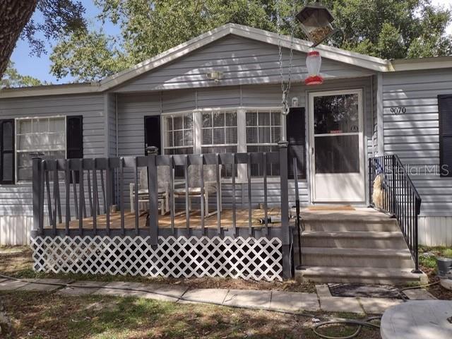 Welcome to this spacious 3-bedroom, 2-bath manufactured home situated on a generous 0.84-acre lot in the peaceful community of Ocklawaha. Offering nearly 1,800 square feet of living space, this home features a desirable split-bedroom floor plan, spacious living areas, and plenty of room both inside and out to enjoy Florida living.

The fully fenced yard provides ample space for boats, RVs, pets, gardening, or future outdoor projects. Conveniently located near the Ocala National Forest, lakes, and outdoor recreation, this property offers privacy while remaining within easy driving distance of Ocala, Belleview, and The Villages.

Motivated seller! Bring all offers! The seller is ready to negotiate and is willing to consider all reasonable offers. Don't miss this excellent opportunity to own a spacious property with endless potential.
