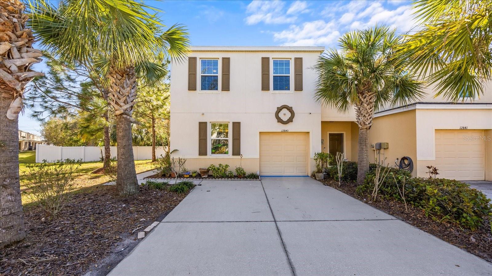 Experience refined comfort in this impeccably maintained and truly distinctive townhome within the gated community of Copper Creek. Meticulously cared for and pet-free, this corner lot residence blends thoughtful upgrades with effortless everyday elegance. Brand new AC system!

The open-concept main living area is enhanced by luxury vinyl plank flooring, upgraded remote-controlled ceiling fans, and an abundance of natural light. A standout feature is the fully permitted, sun-drenched sunroom with hurricane-rated windows — a sophisticated extension of the living space ideal for entertaining, morning coffee, or a private home office retreat.

Upstairs, the spacious primary suite offers a serene escape with dual vanities, generous storage, and a well-appointed en-suite bath. A versatile loft provides the perfect flex space for a reading lounge, workspace, or media nook. The secondary bath features a soaking tub, and the conveniently located upstairs laundry adds functional ease.

Additional enhancements include a well maintained HVAC system with integrated air purification, a versatile bonus room, painted garage interior, and optional AI-enabled security. The extended driveway accommodates 4–5 vehicles and is accented with charming solar lighting — a rare and practical upgrade for townhome living.

Copper Creek residents enjoy gated entry, a community pool, and gazebo, all conveniently located near beaches, shopping, dining, schools, and major commuter routes.

A rare opportunity to own a thoughtfully upgraded residence offering comfort, security, and style in a desirable South Hillsborough location.