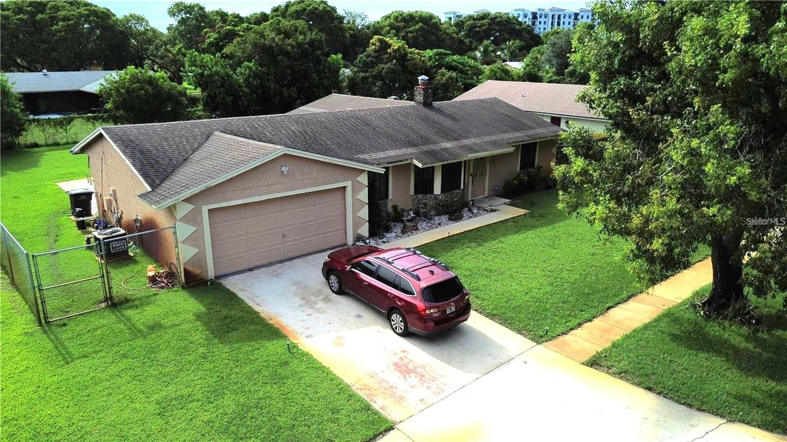 <FIRE SALE><OFFERING SELLER-FINANCE+SUBJECT-TO> <SECTION 8 OPPORUTUNITY> INCREDIBLE OPPORTUNITY in one of West Palm Beach's MOST DESIREABLE neighborhoods! This beautifully maintained 3-bedroom, 2-bathroom pool home with a spacious two-car garage is perfectly situated on a quiet street just moments from schools, parks, waterfront walking paths, shopping, restaurants, major highways, and South Florida's beautiful beaches. Whether you're looking for immediate rental income, a future primary residence, a light value-add investment, or your next fix-and-flip project, this versatile property offers endless possibilities.

                                                                                                                                                                                                  Beautifully landscaped with mature shade trees, lush greenery, and excellent curb appeal, the home welcomes you with an oversized driveway, attached two-car garage, and a charming covered front porch. As you step inside to an expansive, light-filled interior where ceramic tile flooring flows throughout the home. The spacious living and dining areas create an inviting atmosphere for everyday living and entertaining, while the kitchen offers abundant cabinetry, generous counter space, and a breakfast bar overlooking the main living areas. Just beyond, an oversized family room provides the perfect flex space for relaxing and entertaining. The spacious primary suite offers a peaceful retreat with generous closet space and a private en-suite bathroom.Two additional bedrooms are comfortably sized and filled with natural light, while the second full bathroom completes the functional layout.

                                                                                                                                                                                                      Step outside into your own private backyard oasis featuring a large covered patio overlooking a sparkling in-ground pool and an oversized, fully fenced yard. Whether you're hosting gatherings, enjoying weekends by the pool, or simply relaxing outdoors, this backyard offers exceptional privacy and endless room for pets, play, gardening, or future enhancements.

                                                                                                                                                                                                     Major updates have already been completed, including an 8-year-old roof, a newer A/C system less than two years old, and electrical and plumbing systems in excellent working order. The spacious two-car garage also includes the washer and dryer hookups with plenty of additional storage space. An added bonus, the irrigation system is supplied by a private well, eliminating the cost of using municipal water for lawn irrigation and helping keep utility expenses low. Currently occupied by Section 8 tenants paying $3,100 per month through March 2027, the property provides immediate, dependable cash flow. Buyers may continue collecting rental income through the remainder of the lease or negotiate a voluntary cash-for-keys agreement if they wish to occupy or renovate the home sooner. With no HOA, no rental restrictions, strong existing income, and multiple investment strategies available, this is a rare opportunity to own an exceptionally versatile property in one of West Palm Beach's most sought-after locations.