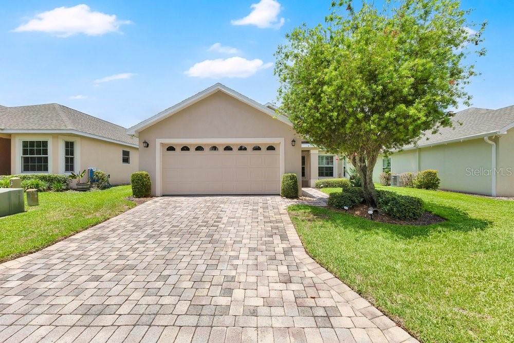 This well-maintained 3-bedroom, 2-bath Garden/Patio home by Reed Builder’s Group Inc. is located in SE Winter Haven in the OSPREY POINTE community featuring maintenance-free living, a clubhouse, pool deck overlooking Lake Ned, and boat dockage availability. Situated on a premium lot, this attractive home offers 1,729 square feet of living space, a paver driveway and walkway, an attached 2-car garage, and inviting curb appeal. Built for quality and peace of mind, the home features precast concrete walls designed to withstand 140+ MPH winds, rounded corners, additional wall insulation, a tubes-in-the-wall pest defense system, security system prewire, and a leaded/beveled glass upper front door insert. Recent updates include all new windows installed approximately 5 years ago by Window World, a new roof approximately 3 years ago, and a gas hot water heater replaced approximately 2 years ago. Inside, you’ll find Mannington Jamestown oak flooring in the foyer, kitchen, and breakfast nook, with ceramic tile in the bathrooms and laundry room. The spacious living room offers vaulted ceilings, abundant natural light, and a comfortable open layout ideal for everyday living and entertaining. The kitchen features raised-panel cabinetry, granite countertops, stainless steel appliances, range is pre plumbed with gas and a bright dining area with plantation shutters. A French door out the back adds charm and convenient access to the outdoor living space. The primary suite provides a relaxing retreat with generous space, natural light, and a private bath featuring dual vanities, granite countertops, a soaking tub, and a separate glass-enclosed shower. Two additional bedrooms offer flexibility for guests, family, or a home office, and the indoor laundry room adds extra convenience also pre plumbed for gas. Washer and dryer included.

Step outside and enjoy the screened lanai, paver patio, and spacious backyard, all contributing to the easy Florida lifestyle this home offers. With strong construction, thoughtful upgrades, recent big-ticket improvements, and desirable community amenities near Lake Ned, this is a standout opportunity in Winter Haven.