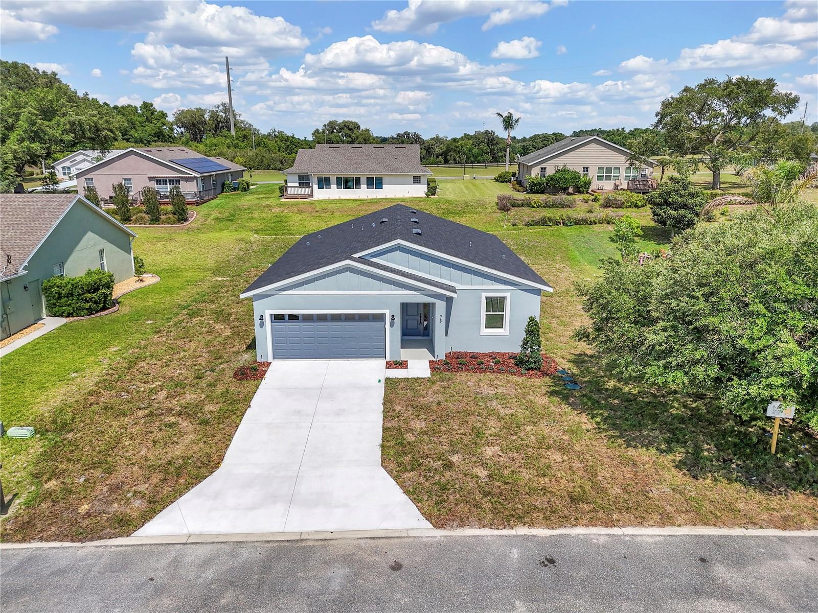 This is the chapter you've been waiting for.
Welcome to your brand-new Brije Custom Home, nestled inside an exclusive 55+ community where every detail has been designed with your next chapter in mind. From the moment you arrive, you'll feel the difference — fresh, clean, and completely move-in ready, because this home has never been lived in by anyone but you.
At 1,543 square feet of beautifully designed living space, this 3-bedroom, 2-bathroom home gives you everything you need and nothing you don't. The open floor plan feels effortlessly spacious, with gorgeous tile flooring flowing through every single room — no carpet, no maintenance headaches, just clean, cool, beautiful floors that are as practical as they are stunning.
The kitchen is a dream, featuring quartz countertops, crisp cabinetry, and finishes that feel far more expensive than the price tag. 
The primary suite is your private retreat — generous in size, with an en-suite bath finished with the same attention to detail you'll find throughout the entire home. Two additional bedrooms give you the flexibility to host family, set up a hobby room, or create the home office you've always wanted.
And then there's the back porch.
Step outside and let Florida do what Florida does best. Whether it's your morning coffee as the sun comes up, an evening glass of wine as the neighborhood quiets down, or simply a place to sit and breathe — this porch was made for the moments that matter most.
Living in a 55+ community means your neighbors are in the same season of life. It means quiet streets, friendly faces, and a pace that actually lets you enjoy what you've worked so hard to build. And with Brije's reputation for exceptional craftsmanship and quality construction, you can move in with complete confidence that this home was built right — from the foundation up.
New construction. Low maintenance. The good life, finally within reach.