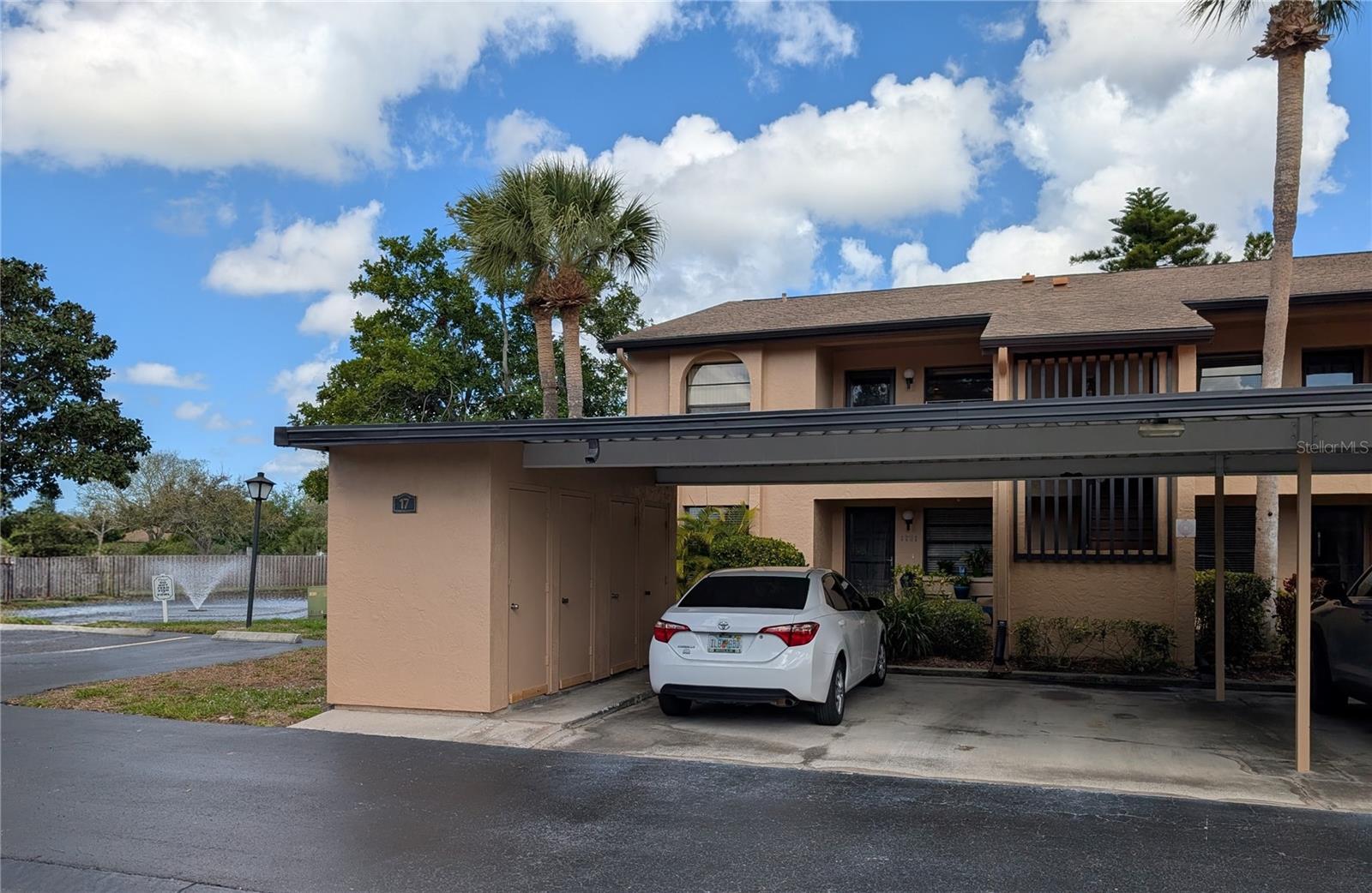 Rare ground-floor convenience and easy Florida living await in this beautifully maintained condo in Bayshore Village—an all-ages community with great amenities and low HOA fees. This comfortable 2-bedroom, 2-bath residence includes carport and exterior storage. Gleaming laminate wood flooring highlights the main living areas, with ceramic tile in the kitchen and baths and new luxury vinyl flooring in the guest bedroom. The kitchen's updated appliances include a brand-new, wide Ruvati sink (16-gauge, lifetime warranty) and Delta sprayer faucet. HVAC system includes a UV light and the system is maintained yearly. The split-bedroom plan offers privacy, and both bedrooms feature new custom built closet shelving. Bathrooms are upgraded with bidet toilets and filtered shower heads. Guest bedroom is currently used as a fitness space and the Florida room as a workspace.  Furnished and move-in ready!  Relax on the small patio overlooking garden views or sit by the peaceful pond. Competitively priced and affordable! The low $400/month HOA covers cable/internet, water/sewer, trash & even interior pest control! Pet friendly provided it's a cat (or service animal). Amenities include an active clubhouse, large heated pool, tennis & pickleball courts, and shuffleboard. Ideally located near shopping, dining, golf, medical facilities, SRQ (airport), and the beautiful sandy Gulf beaches of Anna Maria Island. Interested?  Do not wait...!