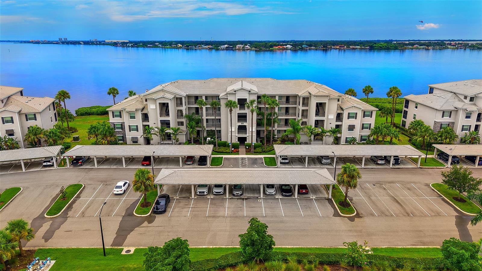 Corner Penthouse alert! Rarely available! Full River views from this 4th floor Birkdale model condo in Tidewater Preserve the Shores! Light and bright and turnkey Furnished (Restoration Hardware). This is a must see! Act fast...Located in 24/7 Manned Gate guarded Tidewater Preserve, these are maintenance free Condominiums with Full River views! This particular model was the preferred floor plan, and it has been lovingly upgraded by the owners. Live life in this wonderful 2-bedroom, 2-bathroom condo which has phenomenal FULL River VIEWS from the entire living area and kitchen. Bonus, the new owner will have an assigned covered Carport and storage directly outside for bikes, golf clubs, etc. Tidewater Preserve is a lifestyle, and this particular unit is down the street from the satellite pool and fitness center. The unit itself has an been lovingly decorated, crown molding, tile floors on the diagonal, with carpet in the bedrooms, Ring doorbell system, coded entry, Honeywell smart thermostat can be connected to Alexa to lock doors remotely and turn down thermostat. The kitchen has Quartz counter tops along with a large island also made of quartz, and stainless-steel appliances, and a great breakfast bar area for additional seating. Your clients will love the Open floor plan. The primary has a walk-in closet, and the ensuite has a wonderful shower, and quartz countertops. Tidewater Preserve is conveniently located near I75, its main pool rivals top resorts with River views and an outdoor grill and fireplace. The Clubhouse has a nice community kitchen, fireplace, and hosts many events. They have an activities director on site, a fitness center, satellite pools, Marina with a 2nd Clubhouse, tennis courts, kayak and canoe launch, walking trail for scenic strolling. The Marina has boat slips that you can rent monthly through the activity director! Come see what all the fuss is about and leave the concrete jungles up North! I have been involved in this community since day one and also own a unit in the complex. Agent can show easily, so call me!
