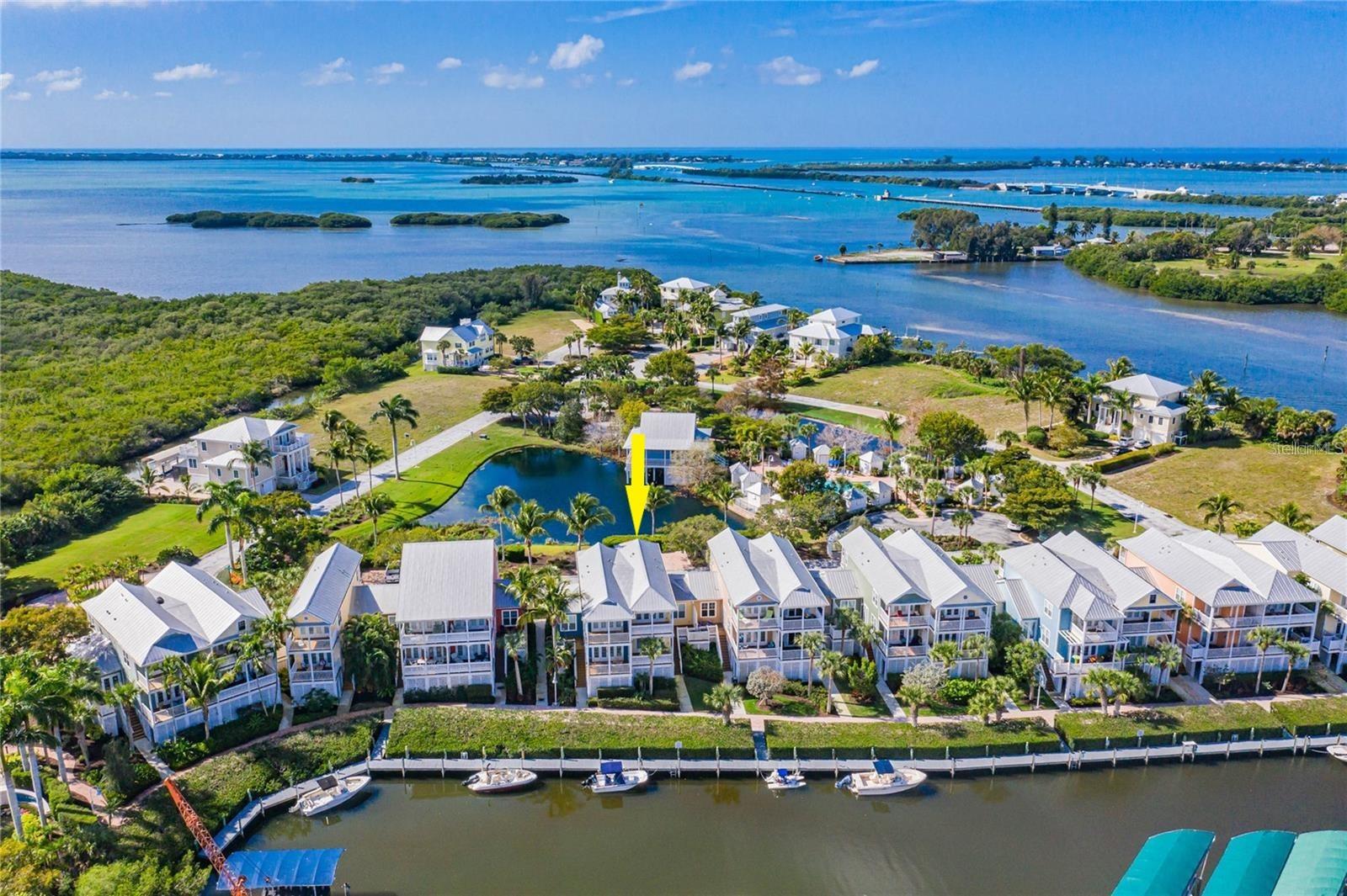 Virtually Staged. RENOVATED WATERFRONT 3 BEDROOM, 3 BATH ANGLERS CLUB TOWNHOUSE! Upgrades in 2023 include NEW KITCHEN, BATHROOM VANITIES, FLOORING, ROOF, COMPOSITE DECKING, IMPACT WINDOWS & DOORS, AND TANKLESS WATER HEATER! The NEW KITCHEN boasts glass accent cabinets, upper display space, tiled backsplash, quartz counters, and stainless appliances! All light fixtures have been upgraded throughout as well as outlets and LED ceiling lights. Bathrooms have new vanities and mirrors. ANGLERS CLUB IS A BOATER’S PARADISE! Included with this ready-to-move home is DEEPWATER DOCKAGE with no bridges to the ICW or Gulf - right outside your back door! The community 1000ft dock allows owners to keep their boats easily accessible behind their home! Rear stairs from the living space conveniently lead down to the dock with composite decking, water and electricity!   Located adjacent to Gasparilla Marina which offers fuel, ships store, storage, service, and a restaurant! Anglers Club amenities include a gated entrance, pool, dockage and clubhouse.  The 7-mile Pioneer Trail is close by for walking and biking, and golf, restaurants, shopping, fishing and beaches are only a few miles away! Call NOW!