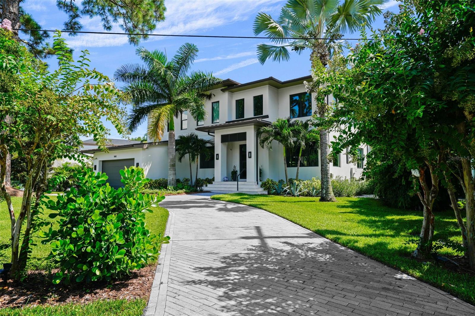Waterfront home on deep canal in Sunset Park, built in 2017 but looks brand new. 4 bedroom, 4.5 baths, large bonus room, separate office, 3 car garage, pool & spa, both
heated by industrial heater, all laid out on 1/3 acre lot. On the first level you find a large foyer, including an open staircase to the second floor, formal dining room with ceiling
beams and wine storage for over 350 bottles, separate den/offlce, guest suite, and a large open bright kitchen with double island overlooking a huge family room with
decorative ceiling beams as well. The kitchen features SubZero and Wolf appliances, including two dishwashers, large 48" range with range hood, quartz counters, newly
installed new back splash and adjacent walk-In pantry & mud room. The breakfast nook has space for a large table and does have a great breakfast bar as well. Wood tile
flooring covers this entire level. The view from this level features the large covered patio with outdoor kitchen, including a Green Egg, pool and spa and the entire backyard
from the pool to the dock is covered with maintenance free turf, plus easy maintenance landscaping for privacy. The second level contains a large Primary Suite with a large
balcony overlooking the backyard and the canal, huge walk·in closet and a primary bath with separate vanities, large shower and a freestanding tub. In addition, this level
features 2 separale bedroom suites, a large bonus room/media room with wet bar and beverage cooler. Large loft and a great laundry room completes this level. The dock Is
equipped with a 13000 lbs lift wtth capacity up to a 34' boat, and the sunset views from the dock are fantastic!