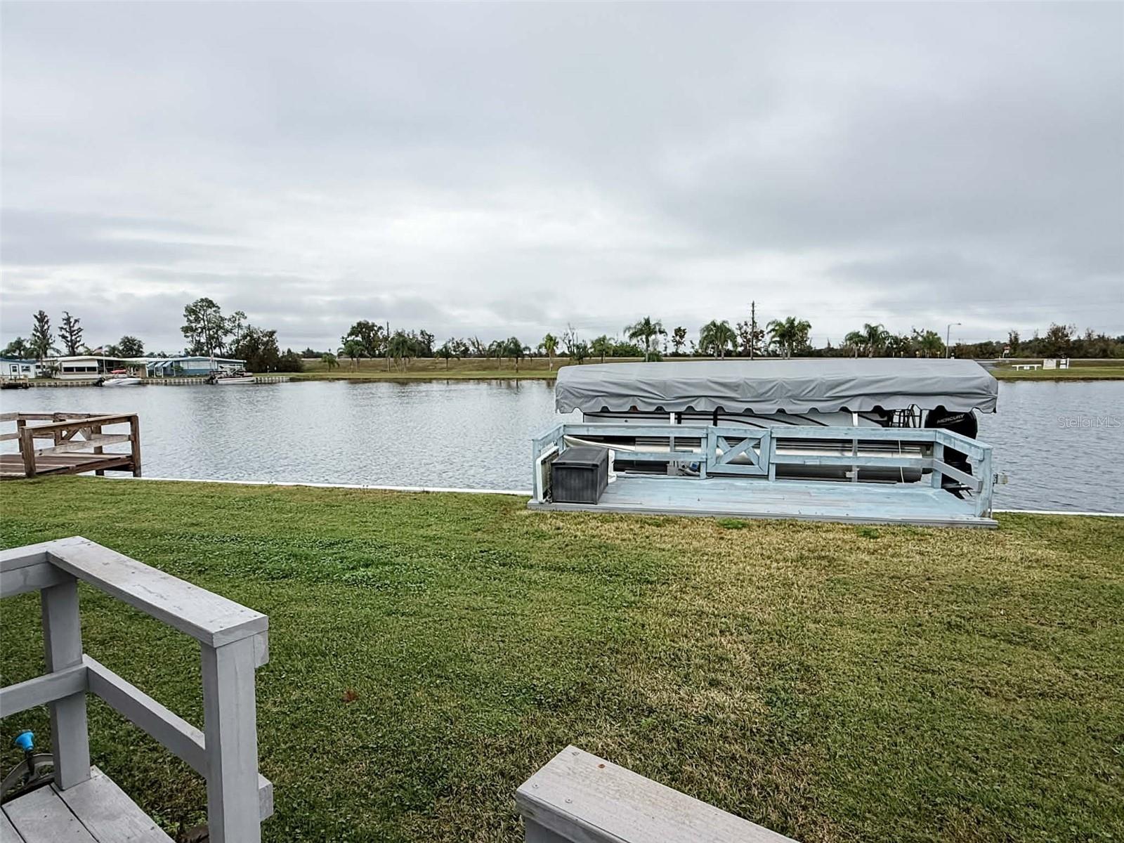 Price Imptovement!  Boating season is here so if you like the lakefront Lifestyle this is the place to be!! Lot 153 sits on the island side of Emerald Lakes, which is all direct lakefront with access to the Clermont chain of Lakes from your back yard!!  Pulling up to this home you will immediately be impressed by the brand new epoxy coated driveway with room for 3 vehicles and comes with a lifetime warranty but that is only the beginning! As you enter the home, you will notice the open kitchen with solid surface countertops and wood cabinets off family room with dining area open to views of your lakefront property.  Emerald Lakes is a 55+ community with private marina and community boat ramp plus heated pool for year-round enjoyment!  Did I mention NO LOT RENT???  Monthly dues of $305 include Cable, Internet, water, trash pick up & grounds, maintenance plus access to the clubhouse which has year-round activities.  Whether you are looking for a second home or want to enjoy the Florida lifestyle full time this is the place to be.  It’s difficult to find lakefront property at this price especially with 10;000 acres of fresh water from your back yard dock.  The decking on dock is currently being redone. Schedule a private viewing today and expect to be impressed!!