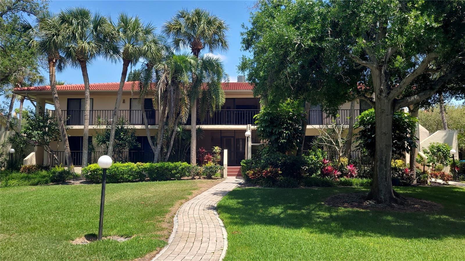 PRICE IMPROVEMENT - Turnkey furnished first-floor 2BR/2BA condo offering effortless Florida living—no stairs required. A spacious screened front porch welcomes you, while the open living and dining area flows to the rear lanai with new tile flooring and serene views of the community pool and lush, park-like grounds. The oversized primary suite features an ensuite bath, walk-in closet, and private lanai access. The second bedroom offers a walk-in closet plus an additional wall closet with convenient access to the guest bath—ideal for guests or a home office. Well maintained and move-in ready, the home also provides flexibility to reflect your personal style over time. Recent improvements include a tile roof replaced four years ago, AC installed in 2022, and water heater updated in 2020. Terrace Two features the lowest condo fees in the community, adding exceptional value. Located in sought-after Wild Oak Bay with resort-style amenities, minutes to IMG Academy, shopping, dining, Sarasota’s cultural attractions, SRQ Airport, and just 8.5 miles to Anna Maria Island beaches—this residence offers comfort, convenience, and enduring appeal.