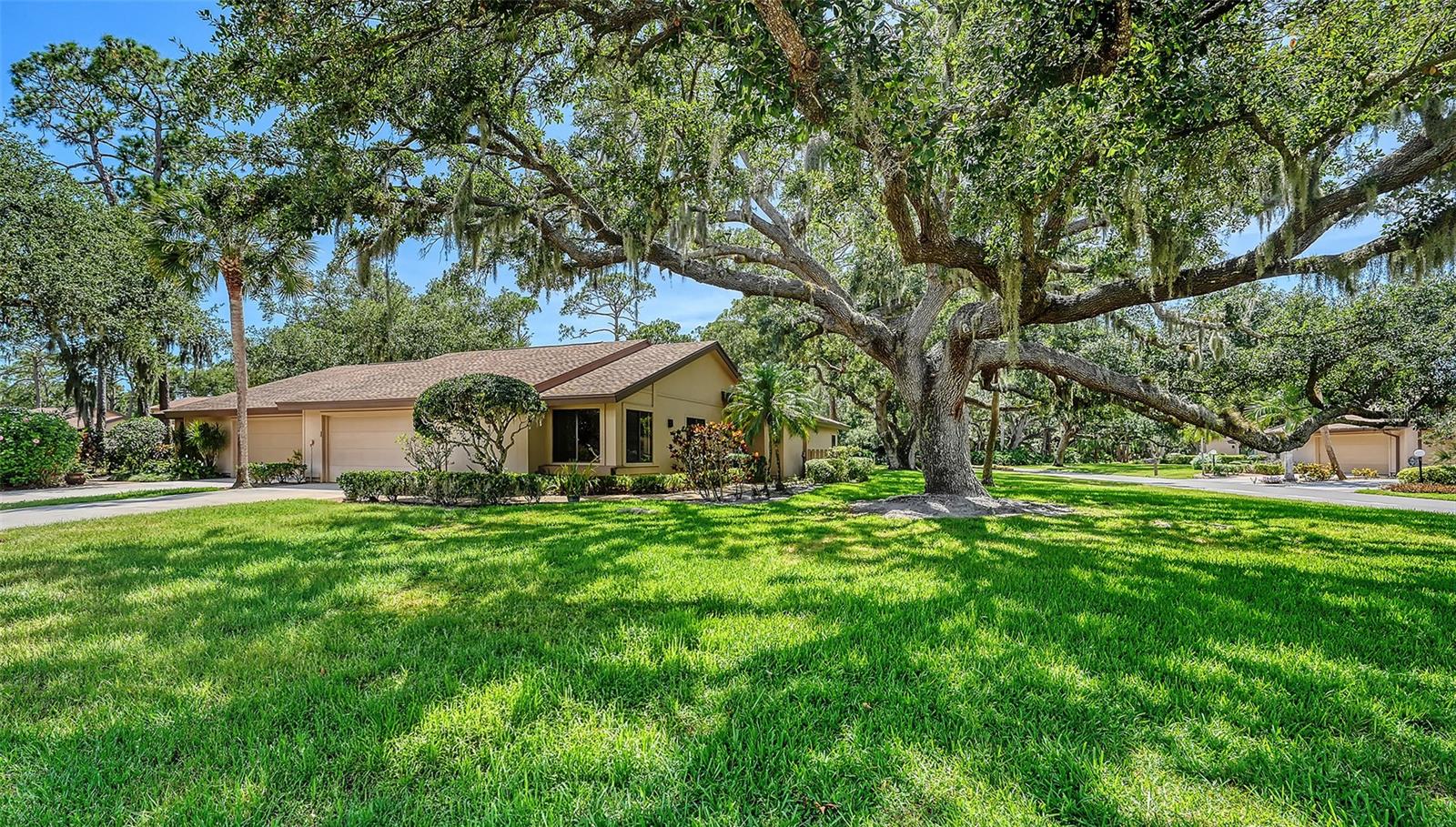 Rarely does a corner-unit villa with such an expansive yard become available. Offering a solid foundation and potential to make it your own, this 3 bedroom, 2 bath residence is located within Hammocks 1, a well-established subdivision in the gated community of Bent Tree that offers maintenance-free living with no age restrictions. With 1,679 square feet of living space, the home features a newer roof (2024) and A/C system (2020), providing peace of mind for years to come. Offered furnished, this property presents a convenient opportunity for seasonal residents or year-round homeowners alike. The screened lanai provides the perfect setting for outdoor dining or enjoying a quiet morning coffee while taking in the peaceful natural surroundings. Frequent visits from birds and deer add to the charm of this unique homesite. Ideally positioned on a quiet, low-traffic street, this property enjoys one of the more desirable settings within Hammocks 1. Additional highlights include a two-car garage, indoor laundry, spacious primary suite with a walk-in closet, and beautifully tree-lined streets that add to the character of the community. Notably, the property is not located within a flood zone, offering added confidence for future owners. Conveniently located just minutes from everyday essentials, including Publix, Walmart, Home Depot, and University Town Center, with easy access to I-75 and a short drive to Sarasota's renowned beaches, dining, and entertainment. Opportunities to secure a corner-unit homesite with this much outdoor space in Bent Tree are few and far between. Schedule your showing today and discover why so many residents love living here.