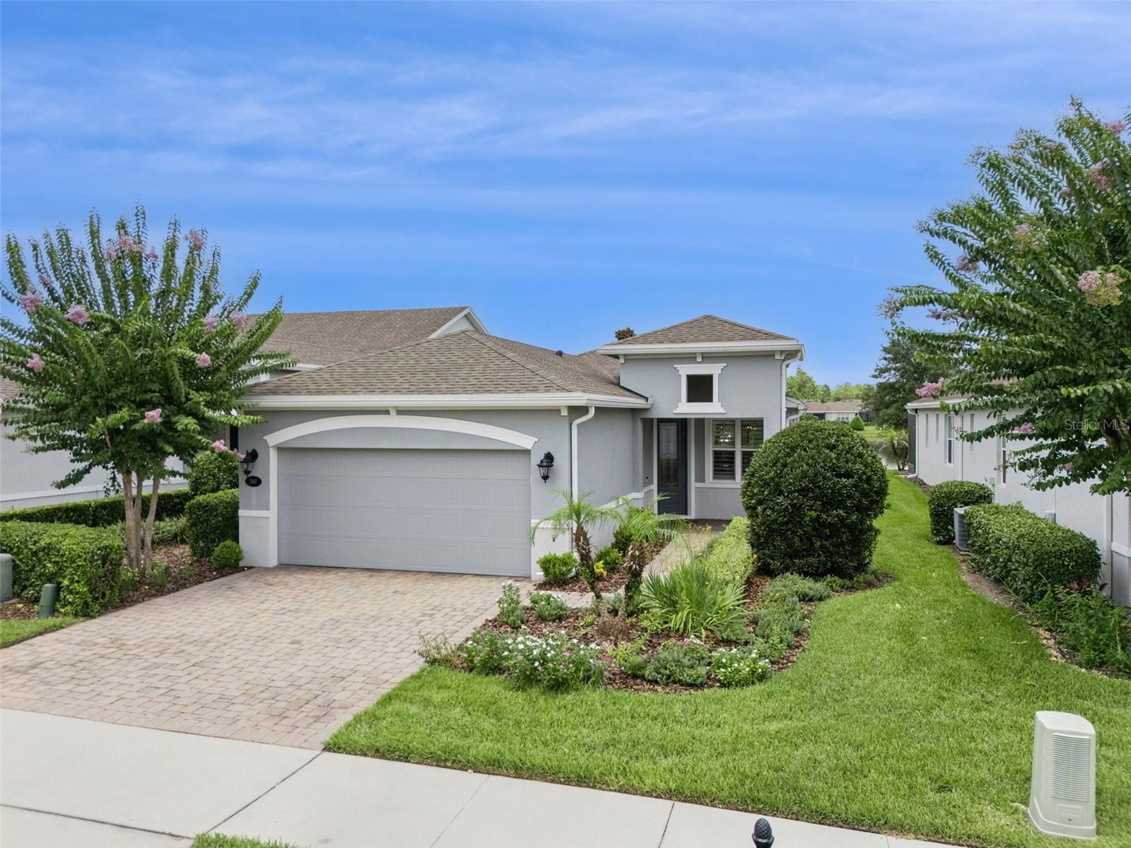 Meticulously maintained Kolter Jasmine with a fabulous Pond view located in the Victoria Gardens 55+ neighborhood. Light & Bright home has many upgraded options to accommodate your lifestyle! Features include double pane windows, crown molding, 5” baseboards, Plantation style shutters, remote controlled shades for sliding glass doors & upgraded lighting fixtures. This 2 BD/2 BA plus Den home has a GREAT ROOM layout. The 9’6” x 11’ kitchen offers 42” “soft close” wood cabinetry w/ crown molding, under cabinet lighting, tile backsplash, pendant lighting above the breakfast bar, Quartz countertops, 5-burner natural gas convection range, stainless steel appliances and an eat-in breakfast nook. Porcelain plank tile flooring flows throughout main living areas & Den. The 13’ x 15’ Primary suite has a wall mounted flat screen TV, 2 walk-in closets, an en suite bathroom w/ 2 raised height Quartz countertop vanities & a large glass enclosed walk-in shower w/ corner bench seat. You will enjoy relaxing having your morning coffee or late afternoon beverage on the 15’ x 20’6” screen enclosed covered patio with a scenic Pond view. Utility room offers a natural gas dryer, washer & storage cabinets. All appliances stay with the home. Victoria Garden residents have access to their own Private Clubhouse. HOA fee includes lawn care, Spectrum HFC TV & internet and reclaimed water for yard irrigation. Community is within 1 mile of I-4 that offers great access to the east coast beaches, Orlando (40 minutes) and 3 International airports within 1 hour.
