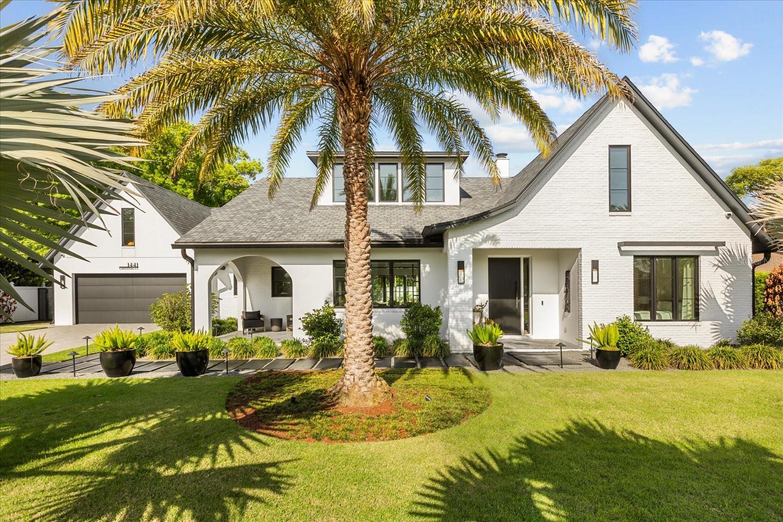 Beautifully built in 2022 by Lonnie Richardson, this custom one-story home sits on a quiet cul-de-sac in the heart of Winter Park. Designed with a modern, timeless style, it offers luxury finishes paired with a warm, comfortable feel.

The home features 4,060 square feet, including four en-suite bedrooms, five full bathrooms, a powder bath, and a bonus room with a built-in office. The spacious gourmet kitchen overlooks the main living areas and pool, and is equipped with premium Wolf appliances and a separate chef’s kitchen for added convenience.

Enjoy seamless indoor-outdoor living with a covered lanai featuring motorized screens, heaters, and a mosquito misting system. The outdoor space also includes a summer kitchen, gas fire pit, and a pool equipped with a swim jet system that creates a continuous current, effectively transforming it into an endless lap pool.

A detached fitness studio with a steam shower provides a private wellness retreat. Additional highlights include custom built-ins, engineered hardwood floors and surround sound throughout.

The oversized two-car garage offers epoxy flooring, custom storage, and a dog wash station. Irrigation is supplied by a private well, and the home also features underground utilities and a full security system.

The exterior is designed for both beauty and low maintenance, with manicured landscaping and artificial turf that stays lush year-round. With no HOA, added privacy, and exceptional attention to detail throughout, this home offers a rare opportunity to experience luxury living at its finest.

This home is conveniently located near the Enzian Theater and less than a mile from Winter Park Village, with top-rated schools nearby, this home combines comfort, style and an unbeatable location.

Schedule your private showing today.