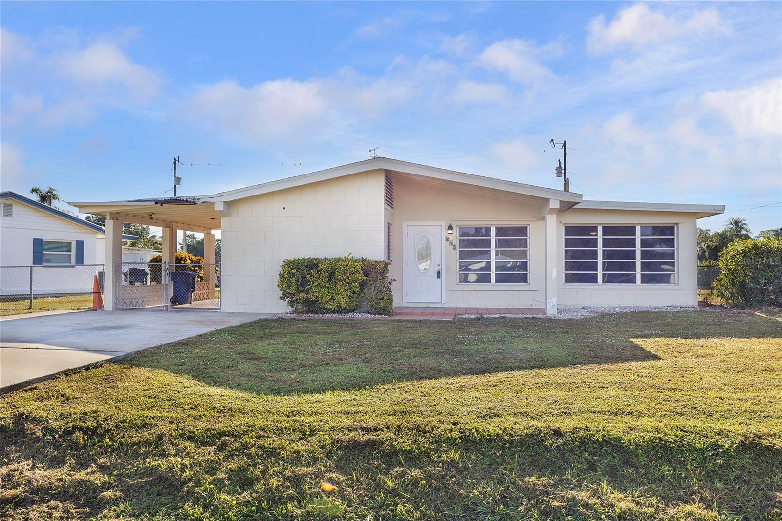 STOP!!! You found just what you are looking for. Charming 3-bedroom 2 bath home built in 1959. Located in the desirable Bert's Bayshore Manor community in North Fort Myers. Enjoy your morning coffee while sitting on the back Lani with the breath-taking view of the lake. Tastefully updated throughout, this home offers a spacious family room and dining area, along with a contemporary kitchen featuring granite countertops, wood cabinetry, and brand-new stainless-steel appliances. The master bathroom has also been remodeled and includes a stylish tiled tub/shower. The back yard included a shed with electricity that is an excellent place for storage or workshop. Enjoy peace of mind with major updates already completed: a new roof in 2022, a new A/C system in 2021, a new water heater, and a washer and dryer that are only two years old. It looks so good with the freshly painted interior, this home is move in ready and full of charm.