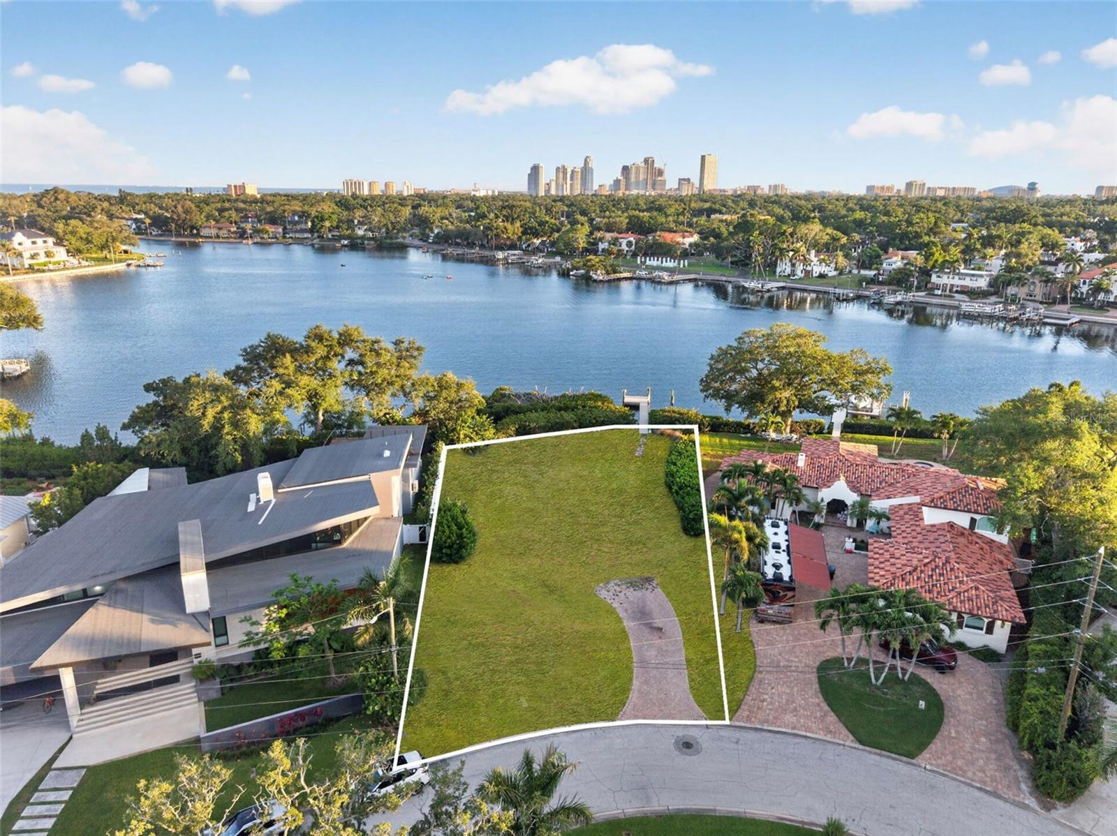 One or more photo(s) has been virtually staged. Set along the glistening waters of Coffee Pot Bayou in the heart of the prestigious Snell Isle enclave, 1026 Monterey Blvd NE represents an extraordinarily rare opportunity to craft a world-class waterfront estate on one of St. Petersburg’s most iconic and sought-after stretches of shoreline. Offering over 100 feet of prized water frontage and spanning nearly one-third of an acre, this exceptional homesite is a canvas for a truly generational legacy property—where architectural vision, panoramic water views, and an unparalleled lifestyle converge. Positioned among some of Tampa Bay’s most significant residences, the property captures the essence of elevated waterfront living with breathtaking open water vistas, tranquil bayou scenery, and the unmistakable prestige that defines Snell Isle. Opportunities of this scale and caliber on Coffee Pot Bayou are exceedingly limited, making this an offering of remarkable rarity for the most discerning buyer, developer, or visionary estate owner. Imagine a custom-designed masterpiece with expansive walls of glass, resort-caliber outdoor living, an infinity-edge pool suspended over the water, and private boating access to Tampa Bay beyond—all framed by the timeless beauty of one of St. Petersburg’s most treasured waterfront corridors. Whether envisioning a modern architectural statement or a timeless coastal compound, the setting provides the foundation for a residence that could stand among the most exceptional homes in all of Tampa Bay. Perfectly positioned just moments from vibrant downtown St. Petersburg, world-class dining, private clubs, waterfront parks, and the city’s thriving arts and cultural scene, 1026 Monterey Blvd NE offers the rare ability to create an uncompromising waterfront sanctuary without sacrificing proximity or convenience. This is more than a homesite—it is an opportunity to build a legacy on the iconic waters of Coffee Pot Bayou.