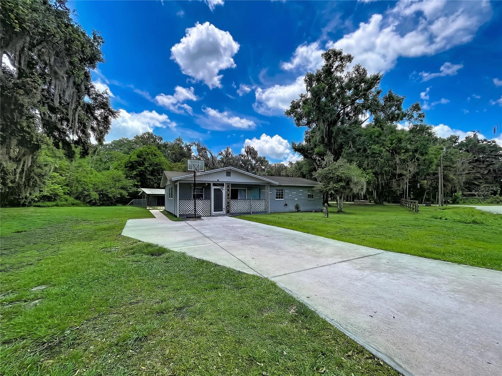 Situated on a spacious lot in the heart of Bartow, this charming 4-bedroom, 1-bathroom home offers comfortable living with the freedom of no HOA restrictions. The property features a welcoming open front porch, perfect for relaxing mornings or evenings, along with a convenient indoor laundry area and a storage shed providing additional space for tools, hobbies, or outdoor equipment. The oversized yard offers plenty of room for entertaining, gardening, pets, or future possibilities. Located in the historic city of Bartow — known as the county seat of Polk County — residents enjoy the area’s small-town charm, beautiful oak-lined streets, historic downtown district, local dining, parks, and community events, while still maintaining convenient access to Lakeland, Winter Haven, and major Central Florida commuter routes.