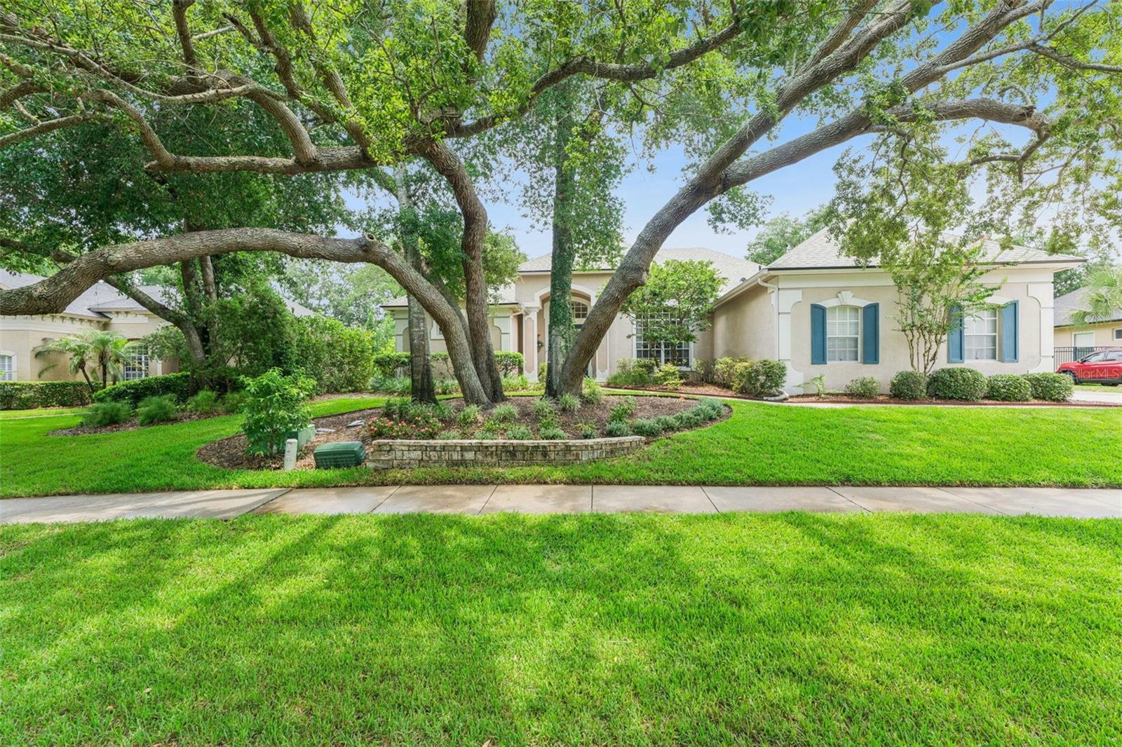 Elegant Custom Pool Home in Woldunn on a Beautifully Landscaped 0.36-Acre Lot with Spa and Screened Lanai

Nestled beneath majestic oak trees on an oversized 0.36-acre lot, this beautifully maintained custom-built 4 bedroom, 3 bath pool home contains 2,724 square feet of thoughtfully designed living space in the highly desirable Woldunn community of Lake Mary.

From the moment you arrive, you'll appreciate the mature landscaping, timeless curb appeal and welcoming front courtyard. Inside, soaring ceilings, abundant natural light and an open split-bedroom floor plan create a spacious yet comfortable atmosphere that works perfectly for both everyday living and entertaining.

The heart of the home is the bright kitchen featuring generous counter space, a large breakfast bar, abundant cabinetry and seamless views of the family room and screened lanai. The adjoining family room features custom built-ins, a gas fireplace and expansive windows overlooking the sparkling pool and spa.

Escape to the spacious primary suite with private access to the pool and lanai. the ensuite bath provides a relaxing Jacuzzi whirlpool tub, separate walk-in shower, dual vanities and ample cabinetry- creating the perfect spa-like retreat at the end of the day.

The thoughtfully designed split-bedroom floor plan provides privacy for everyone, with three generously sized secondary bedrooms and two additional full baths. A flexible fourth bedroom provides the perfect space for a home office, creative studio, media room or guest accommodations.

Step outside into your own private Florida oasis. The expansive screened enclosure surrounds a beautiful free-form pool with raised spa, waterfall feature, large covered lanai and multiple areas for relaxing or entertaining. Mature trees and lush landscaping create exceptional privacy rarely found in today's newer communities.

Recent improvements include a new roof, new HVAC system and new washing machine, allowing the next owner to move in with confidence.

Beyond the home itself, Woldunn provides a lifestyle that's increasingly hard to find. Tree-lined streets shaded by majestic oaks, elegant lantern - style streetlights, beautifully maintained custom homes and newly updated tennis / pickleball court create a warm, inviting neighborhood where residents enjoy evening walks and a true sense of community.  All of this is just minutes from Lake Mary's shopping dining, parks, I-4, SunRail, major Hospitals and top rated Seminole County Schools.
