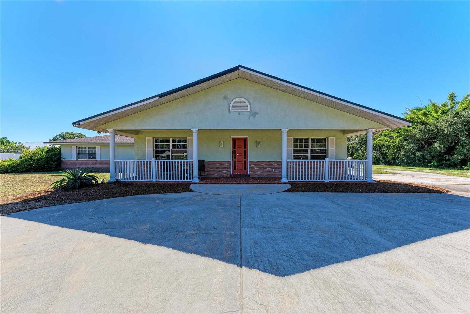 ***RECENT APPRAISAL HAS BEEN COMPLETED***Welcome to a remarkably versatile property designed for multi-generational living or excellent rental income potential, ideally located in the heart of Palmetto. This unique property features multiple separate living areas, each thoughtfully updated and full of character, offering both flexibility and modern comfort. The property also includes a spacious 1,200 sq ft ADU with its own private entrance, in addition to the three other units. The main unit has been tastefully updated with new vinyl flooring, a spacious living room, and a truly impressive kitchen. Renovated in 2022, the kitchen showcases new cabinetry with soft-close doors and drawers, a rare 100-year-old porcelain farmhouse sink, a Zelline gas stove, butcher block accents, and a striking 5’ x 10’ birch wood island that serves as the centerpiece for cooking and gathering. A new dishwasher (installed Nov. 2025) adds modern convenience, while salvaged antique lighting and thoughtful architectural details lend a warm, vintage character throughout. Just off the back of the main unit is a generously sized storage room, currently cooled by a window unit rather than central AC. This flexible space offers potential for use as a hobby room, workshop, or additional bonus area depending on your needs. The second unit offers its own private entrance, new tile flooring, newer stainless steel appliances, and tasteful updates including fresh subway tile in the bathroom ideal for guests, extended family, or tenants seeking a comfortable and functional layout. Additional flexible spaces include an efficiency studio with a kitchenette, full bathroom, and Murphy bed, making it perfect for guests, a home office, or a rental. The property also offers a flex space adjacent to the garage with a commercial kitchen and mini split A/C, which offers great opportunity. The large garage itself features a 20-foot door, a workshop area, interior storage rooms, and a shared laundry area accessible to all living spaces. Impressive structural and mechanical upgrades include a new roof (2025), two A/C units less than three years old, and a Tesla solar system with upgraded inverters, two batteries, and a 15-year transferable warranty. This solar setup keeps electric costs extraordinarily low while adding long-term value and energy efficiency. Outdoors, enjoy an 8-foot privacy-fenced patio, fruit trees, sunny relaxation areas, and shaded nooks for comfort throughout the day. A breezeway offers extra storage, and the included zero-turn Toro mower makes maintaining the grounds effortless. With no HOA, there is complete freedom to park a boat, RV, or additional vehicles right on the property. This location is exceptional just minutes from the Manatee County Fairgrounds, making it ideal for seasonal visitors, vendors, or those who enjoy local events and community activities. The property is also close to Palmetto High School, Lincoln Middle School, and other local schools, offering added convenience for families. For recreation and lifestyle, you’re just moments away from Snead Island, marinas, parks, historic sites, shopping, dining, and the scenic waterfront. Whether you’re seeking a home with room for extended family, income-producing units, or simply a spacious and adaptable living arrangement, this Palmetto property stands out as a truly rare opportunity.
