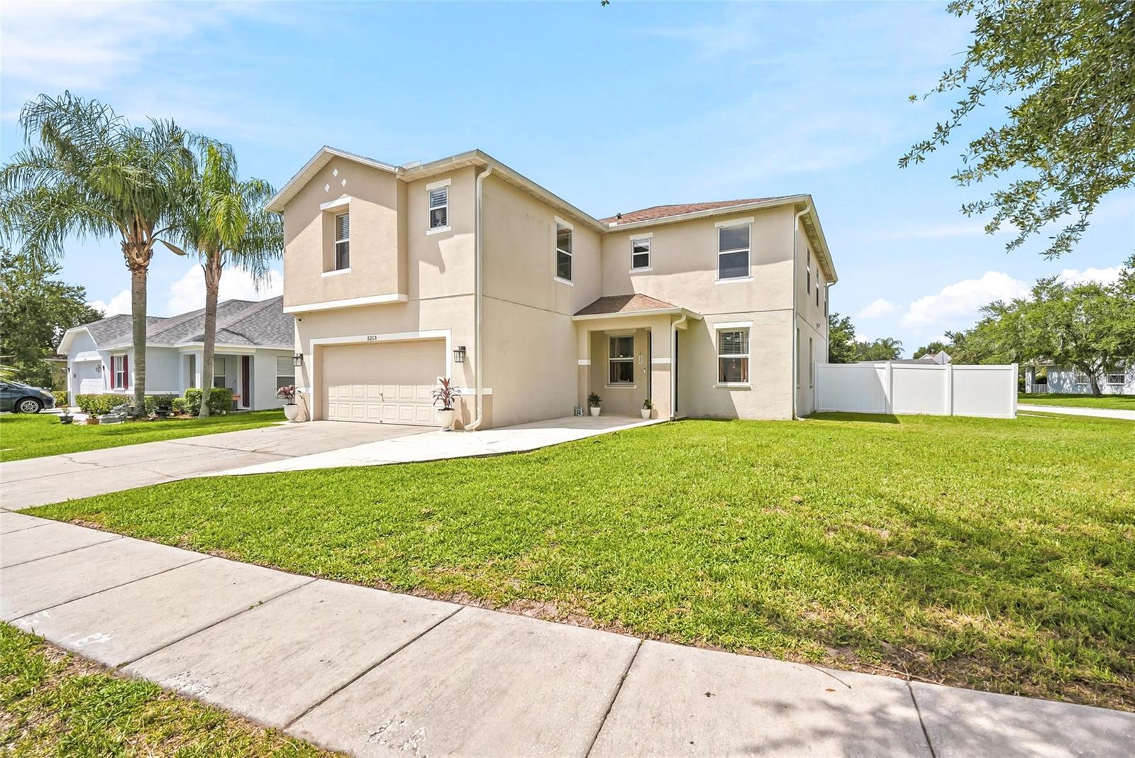 Welcome home to New River Lakes, an established and well-loved community in Wesley Chapel. This 2-story, 5-bedroom, 3-bath home sits on an oversized corner lot with over 3,500 square feet of living space — plenty of room to spread out and settle in. The remodeled eat-in kitchen is the heart of the home, with abundant cabinetry, generous counter space, new appliances, and a breakfast bar that opens right into the family room. The expansive living and dining rooms make hosting easy, whether it's a holiday gathering or a Sunday get-together. A thoughtful 3-way split floor plan gives everyone their own space. A first-floor bedroom and full bath are ideal for guests, while the second-floor primary suite offers a large walk-in closet, garden tub, and separate shower. Three more bedrooms, full bath and a versatile loft complete the upstairs. Beyond your front door, community amenities include a pool, tennis and basketball courts, and a playground — everyday resort living, right at home. Schedule your private showing today and see why 5213 Prairie View Way is the home you've been waiting for.