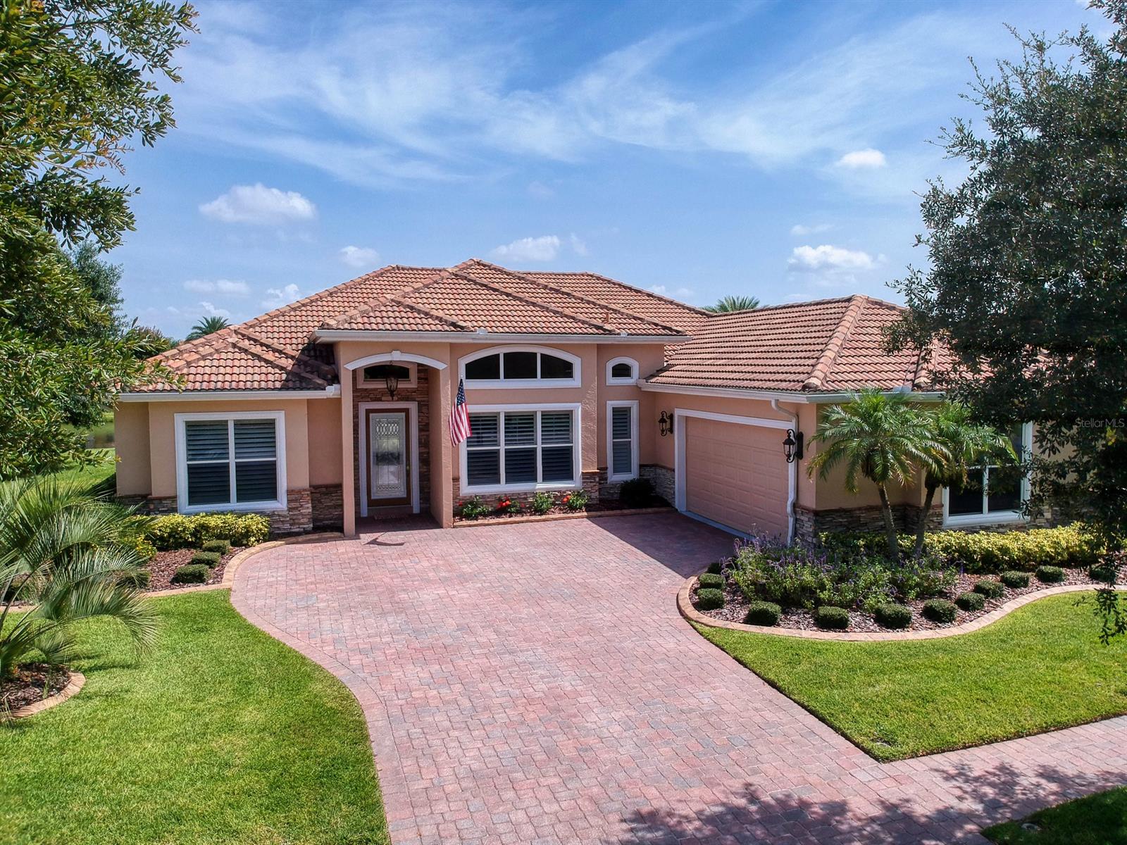 Welcome home to 3539 Grande Tuscany in the gated golf community of Tuscany Reserve in Venetian Bay. Within this custom home, luxury meets, leisurely living, and Johnson Group quality. This Tuscan Villa Style water view home features 4 beds/3 baths & over 2600 square feet of living space, there is plenty of room to roam. Bright and cheerful, the open floor plan flows seamlessly from spacious entry foyer to the bonus room perfect for office/den to the oversized formal dining area then flanked by the spacious living room with 12-foot ceilings. The gourmet kitchen boasts stainless steel appliances, a handy pantry for additional storage and granite countertops and breakfast bar overlooking the living room that accesses the covered lanai through double sliding glass doors offering a calm view of the community pond and fountain.  Private access can also be gained from the Owners Suite.  This welcoming space is features walk in closets and its bath boasts a serene garden tub, double sink vanity and separate walk in shower. Other features include a pavered driveway leading to the 2 car garage a Johnson Group Safe Room and attractive Spanish style tile roofing and all located in the self-sustaining community of Tuscany Reserve in Venetian Bay where you can live, shop, relax and play all in one premiere golf community. ;Water: City