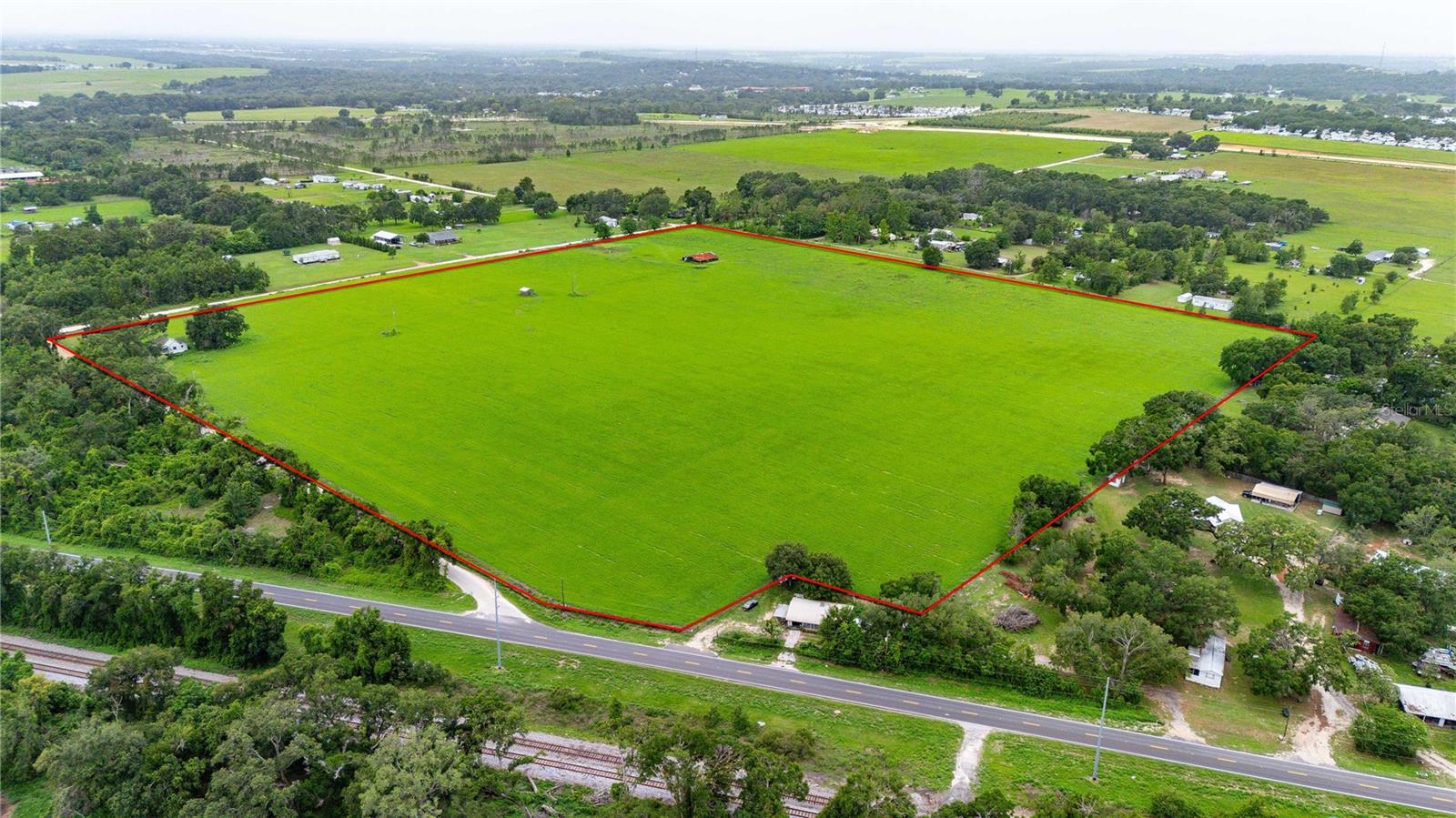 Under contract-accepting backup offers. Prime Development Opportunity – 38.73 Acres in Growing Dade City
Unlock the potential of this exceptional 38.73-acre parcel located off of Old Lakeland Hwy/ 35-A. Zoned AR and AC, this versatile property is currently utilized as a fully operational sod field, benefiting from greenbelt designation and extensive agricultural infrastructure.
The land features four 4" wells and a 12" SWFWMD-certified well, ideal for irrigation or future community use. Electricity is already connected, adding to the property's readiness for transformation. With future land use designated as Residential-1 (1 home per acre), this cleared, high-and-dry site presents an exceptional opportunity for residential development, estate homes, or agricultural continuation.
Strategically located along Wilds Road and Old Lakeland Highway/35A with 108 feet of road frontage, and just minutes from Highway 98, the area is rapidly expanding with increased residential and commercial interest. This site is ideally positioned for a forward-thinking investor, developer, or end-user looking to capitalize on one of Dade City's most promising growth corridors.
Don't miss this rare opportunity to acquire nearly 40 acres of prime, development-ready land in Pasco County.