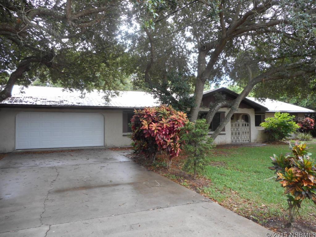 Live within a short walk to the beach! This beachside beauty sits on a large 100 by 150 foot lot with large oak trees in the backyard providing a park like setting. The 50-year metal roof provides the much needed covering for beachside. The inside provides a large living area at 2080 square feet with three bedrooms on the right side of the home, one private bath and a hall bath. There is a formal dining the opens into the family room as well as a large living room leading into a Florida Room looking over the backyard. The inside utility has a full bath as well and leads out to the back yard. All of this within a short walk to the beach or the river! This is a Fannie Mae HomePath Property! ;Water: City