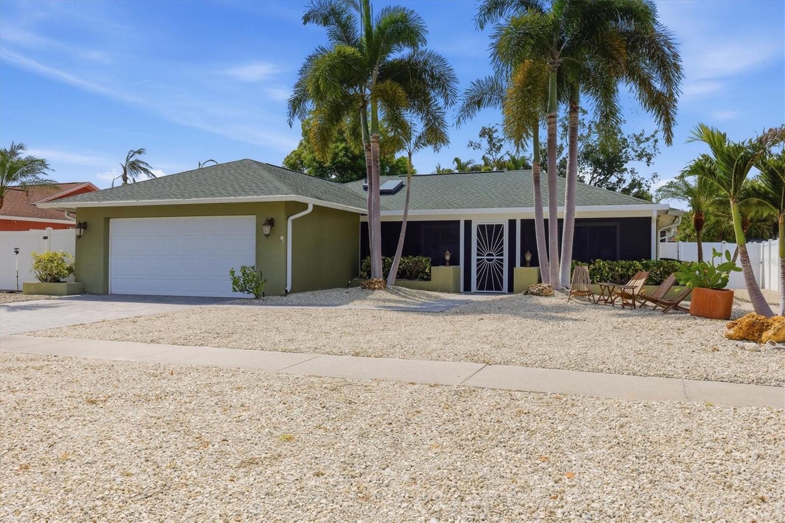 Welcome to one of Sarasota's hottest neighborhoods—Tamaron—where this beautifully updated heated pool home offers the perfect blend of comfort, style, and privacy. A newer screened front porch with custom tile accents creates a welcoming entrance and the ideal place to enjoy your morning coffee or unwind at the end of the day. Inside, the expanded coastal-inspired kitchen serves as the heart of the home, featuring granite countertops, custom built-in shelving, a charming window bench, Whirlpool appliances, and ample space for casual dining. The open floor plan flows effortlessly through the spacious living and dining areas, highlighted by updated light fixtures, tile flooring throughout the main living spaces, and warm wood flooring in the bedrooms.

The primary suite offers a spa-like retreat with a custom stone walk-in rain shower featuring four body jets. Designed for entertaining, the oversized Florida Room includes a beautifully remodeled wet bar and overlooks the screened lanai, heated pool, and private backyard oasis. The fully fenced yard showcases eco-friendly gravel landscaping for low-maintenance living, a striking double waterfall with a three-tier water feature, accent lighting, and an irrigation system for the surrounding tropical landscaping.

Recent improvements provide peace of mind and modern convenience, including a new roof (2020), air conditioning system (2020), upgraded electrical panel, updated pool pump system, newer windows, exterior paint, gutters, brick paver driveway, updated kitchen backsplash, Nest thermostat, Ring doorbell, newer pool cage and patio enclosure, and paver enhancements surrounding the outdoor living areas.

Perfectly located just minutes from Downtown Sarasota, Siesta Key Beach, UTC shopping and dining, and countless restaurants, parks, and cultural attractions, this move-in-ready Tamaron home offers exceptional indoor-outdoor living in one of Sarasota's most desirable established communities.

Tile flooring extends throughout the main living spaces, while warm wood floors enhance the bedrooms. The primary suite offers a spa-inspired bath highlighted by a custom stone walk-in rain shower with four body jets.
Designed for entertaining, the oversized Florida Room features a beautifully remodeled wet bar and overlooks the screened lanai, sparkling pool, and lush tropical backyard. The fully fenced yard provides exceptional privacy, creating your own backyard retreat.
Thoughtful updates include a new roof (2020), air conditioning system (2020), newer windows, exterior paint, gutters, Whirlpool kitchen appliances, a Nest thermostat, Ring doorbell, an updated kitchen backsplash, and paver enhancements surrounding the pool and outdoor living areas.
Ideally located just minutes from Downtown Sarasota, world-renowned Siesta Key Beach, UTC shopping and dining, and everything Sarasota has to offer, this exceptional Tamaron residence will be hitting the market soon. Stay tuned for additional details.