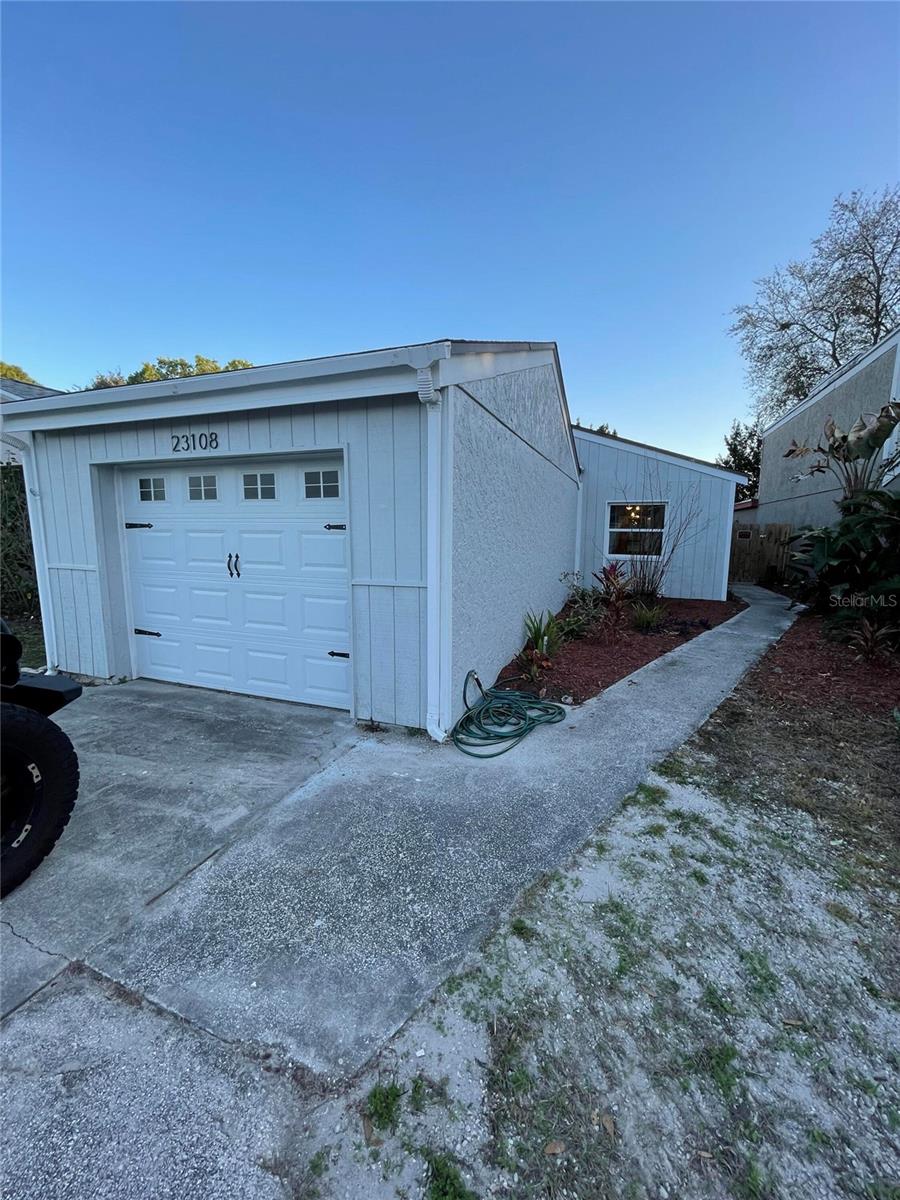 Welcome to this beautifully updated home nestled in the serene community of Land O' Lakes, where comfort, style, and resort-style amenities come together to create the perfect Florida retreat.

This spacious and inviting home underwent a full renovation in 2022, featuring thoughtful modern upgrades throughout. The beautifully updated kitchen is designed for both everyday living and entertaining, complete with brand-new stainless steel appliances installed in 2022, generous counter space, and newly replaced kitchen flooring completed in 2024. Additional major updates include a fully renovated bathroom in 2022 and a brand-new roof installed in 2024 (Permit pending), offering peace of mind for years to come.

Bright and airy living spaces flow seamlessly throughout the home, with sliding glass door access to the spacious backyard from both the primary bedroom and the sunroom, creating abundant natural light and easy indoor-outdoor living. The beautifully landscaped backyard and patio area provide the perfect setting for relaxing evenings, entertaining guests, or enjoying the Florida sunshine.

The home is being offered furnished, with furniture shown in the photos included in the sale. Highlight pieces include a stunning hand-carved Mexican wood dining table and matching hutch set, adding timeless craftsmanship and warmth to the home's character.

Located within a highly desirable resort-style community, residents enjoy access to exceptional amenities including an Olympic-size swimming pool, tennis courts, a neighborhood bar, and a convenient sandwich shop - offering amazing amenities while living right at home. Conveniently situated near shopping, dining, parks, and local amenities, this move-in-ready property is the perfect combination of comfort, convenience, and lifestyle.