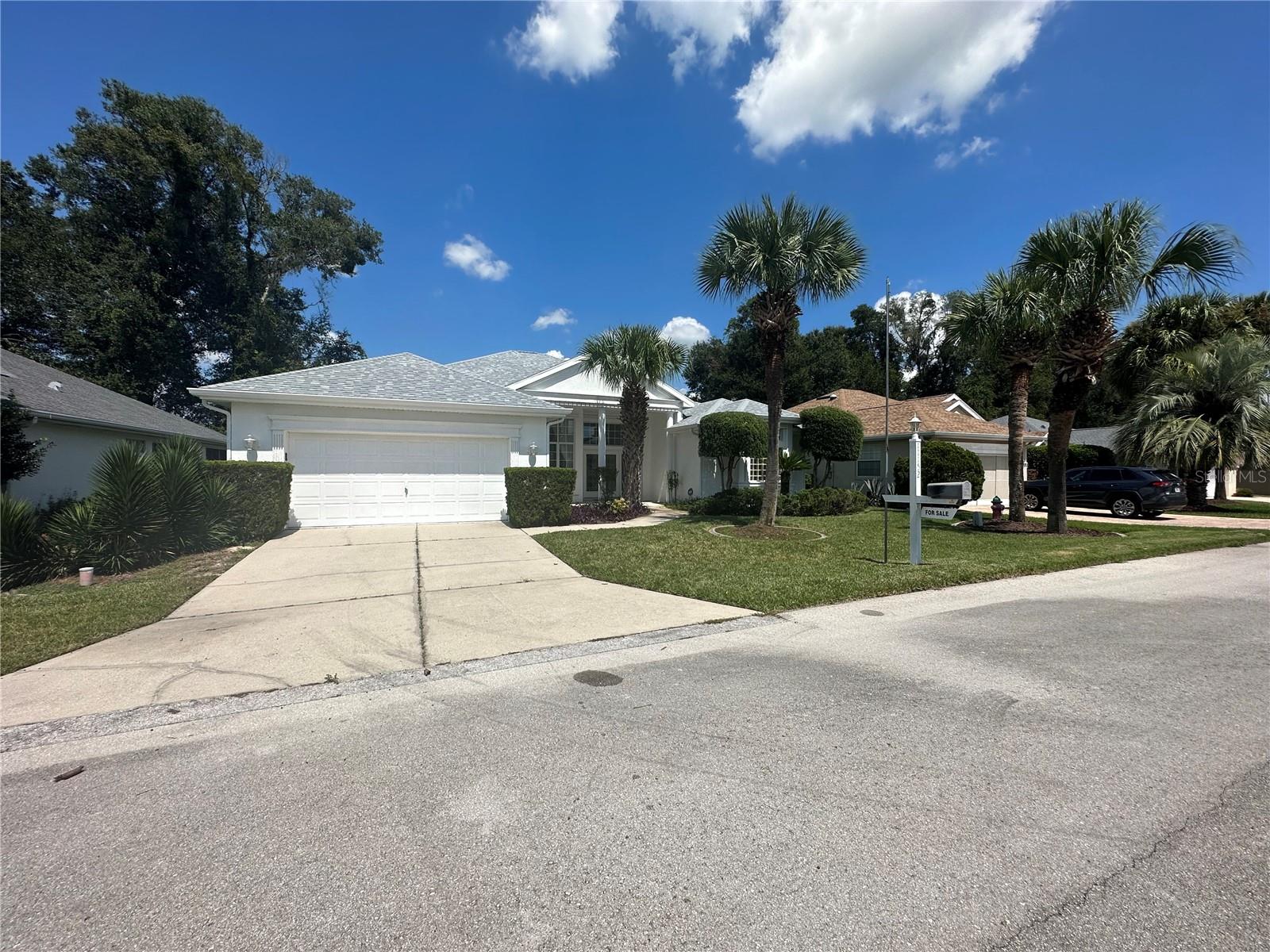 Reduced almost 40K!!! Owners are out of state and Motivated. Brand New Roof. This highly sought-after Monaco model boasts an open floor plan with 3 bedrooms, 2 bathrooms, a spacious family room, and a 2-car garage. Hurricane shutters provide peace of mind.
Nestled in the desirable Fountains neighborhood of Oak Run Country Club, this home welcomes you with a grand front porch and elegant glass-accented double doors. Inside, you'll find light ceramic tile throughout the living spaces, a generously sized kitchen with ample cabinets and a central island, a formal dining room, and a convenient indoor laundry room. The property is fenced for your pet's safety, and a large wrap-around lanai offers outdoor enjoyment.
The master bedroom features his and her walk-in closets, while the Master En Suite bathroom boasts a garden tub, a glass block window, a separate step-in shower, and His & Her vanities. The property also includes concrete curbing and offers over 2000 square feet under HVAC. Don't miss the opportunity to make this fantastic home your own! If you are in the market for a great home in a great development, then this one is a must see. Community service fee includes garbage/yard debris pickup, basic cable with community channel 12, use of amenities (golfing extra fee). Oak Run Country Club has 6 swimming pools, 5 whirlpools, library, 2 workout rooms, card room, billiard room, ceramics/craft room, on site restaurant, driving range and an 18-hole golf course. Shuffleboard, pickle ball, horseshoes, bocce ball, tennis, wow! So many clubs to join and a DOGGIE Park too.
