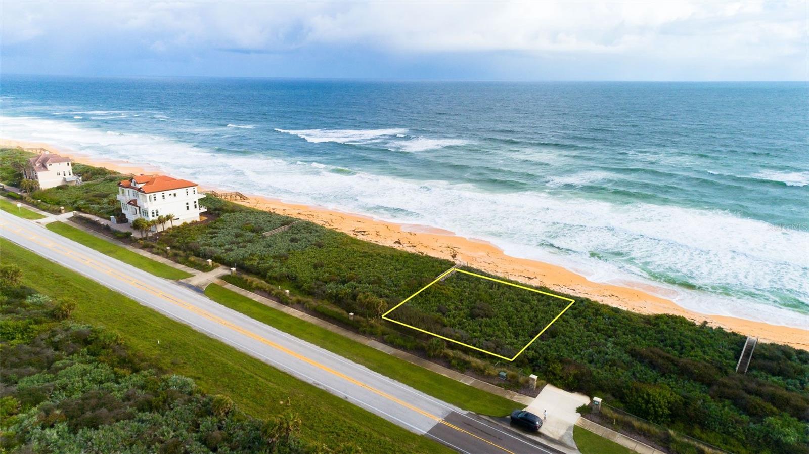 DIRECT OCEANFRONT homesite! This lot offers with 100 ft. of frontage on the Atlantic Ocean in the prestigious, gated, golf community of Hammock Dunes. This 100'x88' lot has no mandatory build time and already has underground utilities in place. Hammock Dunes is a private, gated golf course community with two golf courses, community pool, oceanfront clubhouse, full service pro shop, state of the art ocean view fitness center, tennis courts, two bocce ball courts, pickleball, croquet, card room, and so much more. The oceanfront clubhouse features fine dining, a 19th Hole bar, and a stunning balcony overlooking the Atlantic Ocean. 

This lot is located in the Carino La Mer neighborhood of Hammock Dunes where every two lots share a dune walkover to the coquina sand beaches of Flagler Beach. 20ft setbacks on North and South sides allows for a 60ft wide residence.  60ft home height maximum.  3,500SF interior living area minimum for all homes built.  

Half or full day tours of the amenities, golf courses & private clubs are available for potential buyers upon request. All information is intended to be accurate but cannot be guaranteed.