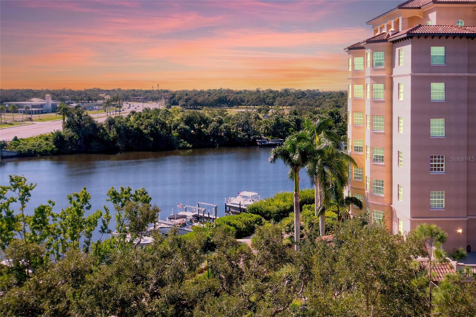 Price Adjustment! An exceptional value for the view, location, and lifestyle—this sixth-floor, two-bedroom, two-bath residence is a rare opportunity that should not be overlooked. From the moment you enter, expansive water views command your attention, setting the tone for this open and inviting floor plan where water surrounds you in every direction. The spacious, light-filled kitchen offers abundant storage and serves as a natural gathering place for guests. Just beyond, you’ll find a convenient laundry closet, a full guest bath, and a generously sized second bedroom—ideal for visitors or a home office. The main living area easily accommodates both comfortable seating and a formal dining arrangement, flowing seamlessly into the great room and out to the oversized screened balcony. This elevated vantage point is perfect for relaxing, entertaining, and taking in sweeping waterfront views that are increasingly hard to find at this price point. The owner’s suite is thoughtfully positioned for privacy and features direct access to the lanai, allowing you to wake up to tranquil water views each morning. Two walk-in closets and a spacious en-suite bath with both a soaking tub and separate shower complete this retreat. This unit has a deeded parking space under cover in the garage. There is also a storage unit assigned to this unit for seasonal accents. Set within a beautifully maintained 10-acre waterfront community, residents enjoy resort-style amenities including a heated pool and spa, fitness center, clubhouse, and an expansive promenade along the water—ideal for sunset strolls. There is a Kayak launch access and private storage racks offer direct connection to Phillippi Creek for boating and nature lovers. The location further elevates the value: minutes from The Landings Shopping Center, Southside Village, downtown Sarasota, UTC Mall, and the white-sand beaches that define Florida’s Gulf Coast. When combined with the views, amenities, and low-maintenance lifestyle, this residence represents an outstanding opportunity—offering coastal living at a price that is increasingly rare for this setting.