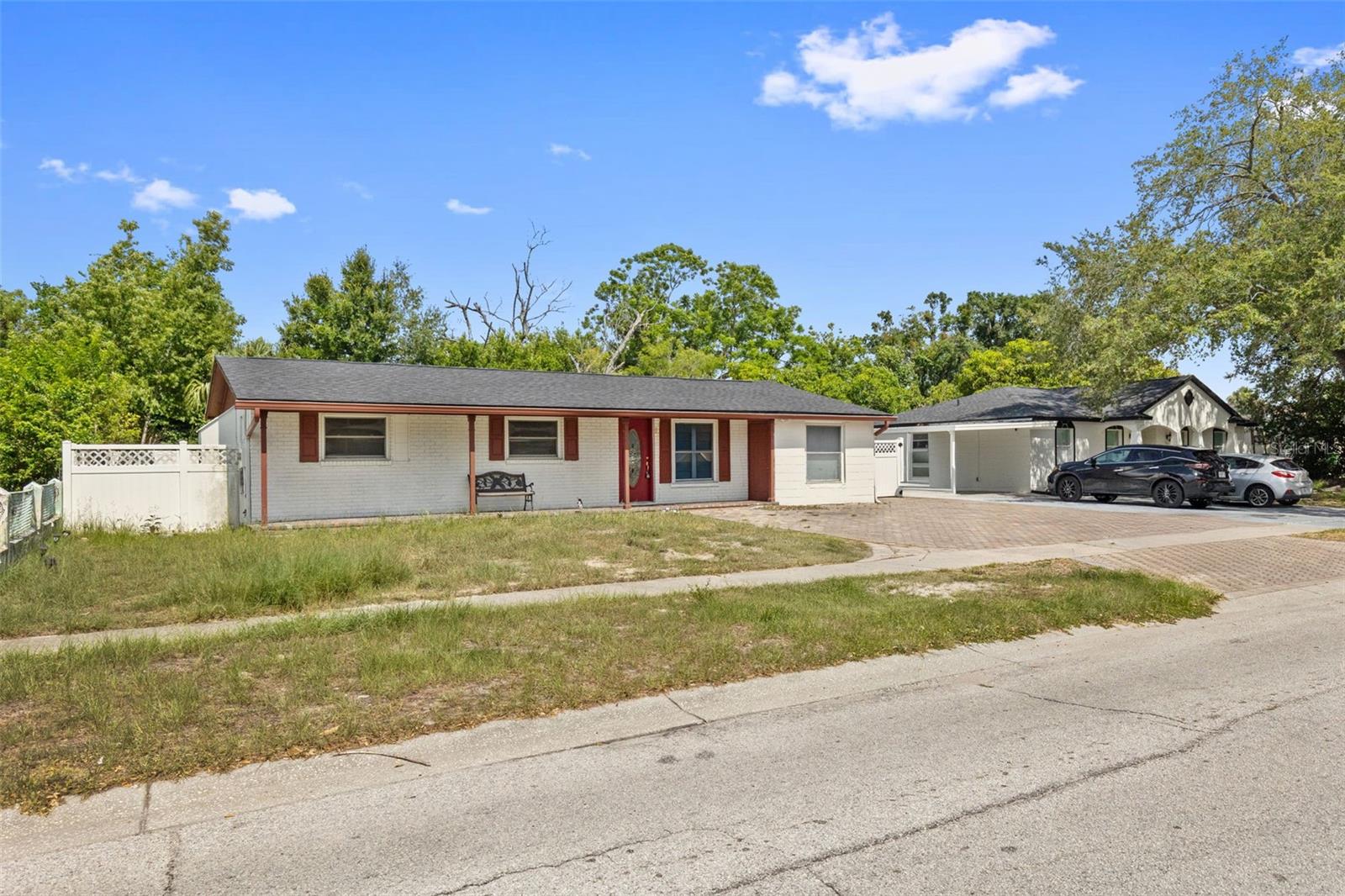 This versatile property offers the perfect combination of comfortable living and income-producing potential. The main home features three spacious bedrooms, a bright living room, dedicated dining area, functional kitchen, and a large screened porch ideal for relaxing or entertaining year-round. Adding exceptional value is a separate efficiency unit complete with its own kitchen, bath, living area, and sleeping space, currently generating $1,100/month in rental income. Major updates include a brand-new roof installed in June 2026, providing peace of mind for years to come. Ideally located in the heart of the Tampa Bay area, the property is less than 30 minutes from Busch Gardens Tampa Bay and the Courtney Campbell Causeway Trail, less than 40 minutes from award-winning Clearwater Beach, and just minutes from Tampa International Airport, International Plaza, WestShore Plaza, and countless shopping, dining, and entertainment options. Whether you're seeking a primary residence with supplemental income, a multi-generational living arrangement, or a strong investment opportunity, this property delivers flexibility, convenience, and value. Seller is highly motivated and welcomes reasonable offers.