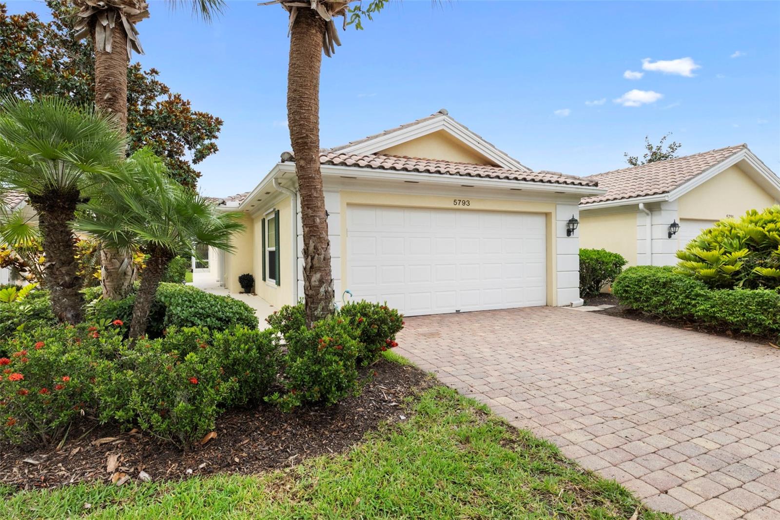 Rarely Available Extended Capri III Villa W/ Heated Swimming Pool! New to the market, this home has been well maintained and recently upgraded with Hurricane Windows. Built Solid By DiVosta Homes, this 2 bedroom/2Bath Villa is constructed of poured concrete and steel. Designed for seasonal or fulltime residents, the home is very low maintenance.  Lots of features and upgrades! VillageWalk is one of Sarasota county's jewels. A true lifestule community with a fulltime activities director, 2 heated pools, 6 HAR-TRU tennis courts, Pickleball and basketball courts plus a State-of-the-Art fitness Center. The Community TownCenter hosts a variety of activities be it card game, club meetings, guest speakes, bite at the onsite Cafe', a visit to the gift shop or possibly a nail or hair appointment onsite at the Salon. There's even a Gas Station for your convenience!! Schedule a showing today!