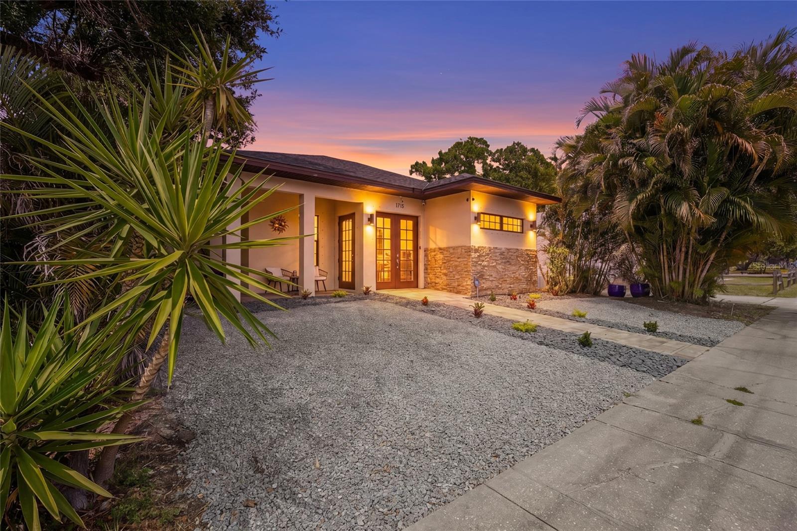 STYLISH NEWER CONSTRUCTION POOL HOME close to Downtown Sarasota with 3 Bedrooms / 2 Baths and ACTIVE Airbnb History! Located in one of the few areas within Sarasota allowing WEEKLY RENTALS, this beautifully designed residence offers the ideal blend of modern luxury, indoor-outdoor living and incredible proximity to Downtown Sarasota, Bayfront Park, St. Armands Circle and the Gulf beaches. Inside, the home features a thoughtfully designed layout filled with natural light, high ceilings and contemporary finishes throughout. The spacious kitchen offers sleek cabinetry, stainless steel appliances, oversized island seating and easy access to both the dining and living areas creating a comfortable flow for everyday living and entertaining. The split-bedroom design creates privacy and functionality while the spacious primary suite feels like a true retreat featuring a spa-inspired ensuite bath with dual sinks, soaking tub and stunning open-air shower. Two additional guest bedrooms offer flexibility for visitors, family or home office space. Designed to embrace the Florida lifestyle, the outdoor living area is truly exceptional featuring a private pool, hot tub, outdoor kitchen, beverage fridge and multiple entertaining spaces surrounded by lush tropical landscaping. Whether enjoying quiet mornings poolside or hosting guests for dinner and cocktails, the seamless indoor-outdoor flow creates the ultimate Sarasota retreat. Currently operating as an active Airbnb, this property offers outstanding flexibility for full-time living, seasonal use or investment potential. Recent addition of solar panels for cost friendly utility bills. Conveniently located just minutes from Sarasota’s top dining, shopping, entertainment and waterfront attractions, this is a rare opportunity to own a newer construction home with weekly rental flexibility in one of Sarasota’s most desirable areas.
