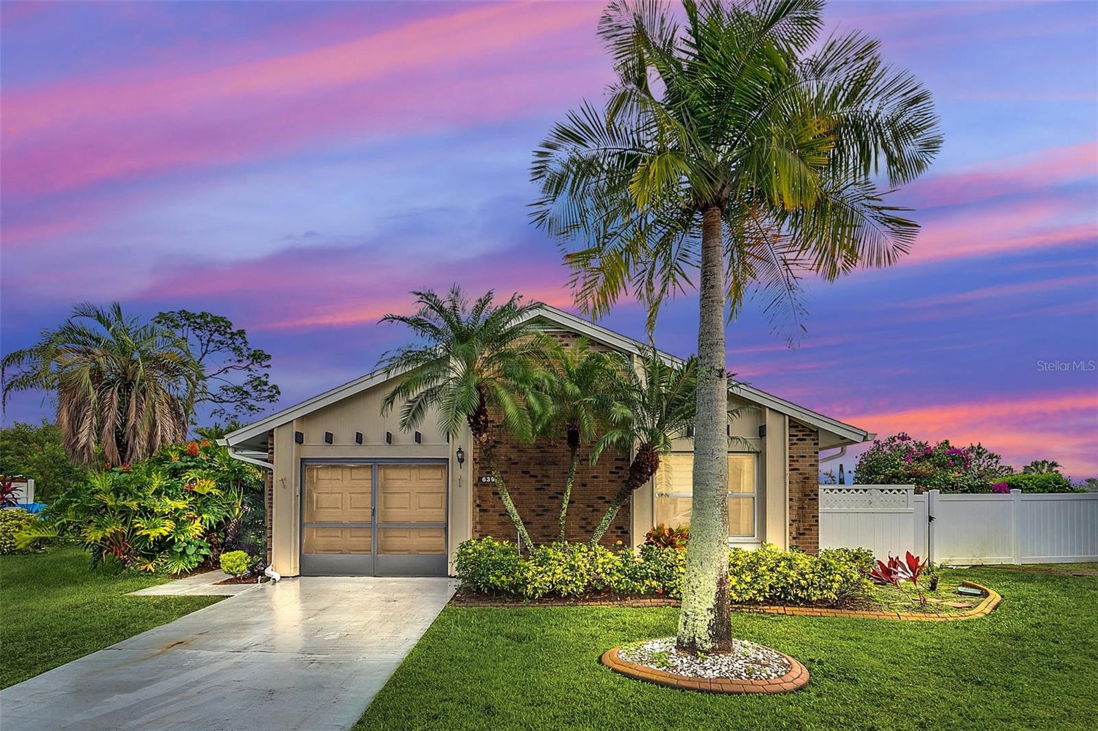 Live in your own resort! This highly upgraded, 2 bedroom, 2 bath home is located on the 8th hole of Ventura Country Club’s golf course. Features include porcelain tile floors, new windows, new roof, custom blinds, and custom draining system. The dream kitchen features exotic granite slab counter tops and backslashes, a nearly new Samaung range with air fryer mode, new lighting, and custom electrical and USB outlets. Both bathrooms have been remodeled. Guest bathroom has custom antique style vanity with glass vessel sink, and a frameless shower. Because of the unique triangular shape of the lot, this is one of the few VCC golf course front properties that also has a large, fenced side yard - perfect for pets. (HOA rules don't allow fences on property adjacent to golf course.) Enjoy fabulous Country Club living amenities without the expense. Ventura Country Club is owned by the HOA so residents can use its tennis courts, Olympic sized swimming pool, fitness center, playground, hiking trails, banquet facilities (up to 4 hours), & restaurant facilities at no cost. Residents have access to the 18 hole golf course, recently renovated, at reduced rates. The Community offers many activities including ACBL Sanctioned Duplicate Bridge games and lessons, Pickleball, Cooking Classes, Book Club, Holiday Celebrations, and much more. VCC is a beautifully landscaped and well maintained community of over 1700 luxury homes and condominiums in Southeast Orlando. It is located close to shopping, restaurants, Downtown Orlando, Orlando International Airport, Highways 408 and 417 and SR-436. Note: some photos have been virtually staged.