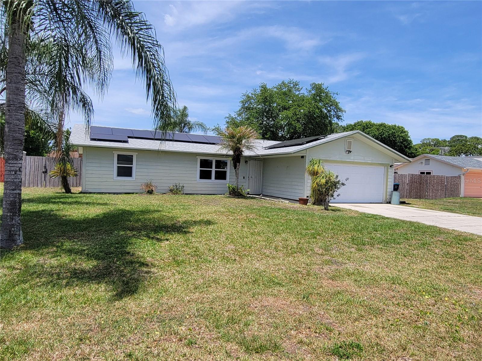 One or more photo(s) has been virtually staged. Palm Bay pool home offering a 3-bedroom, 2-bath split-plan layout with a fenced backyard and attached two-car garage. The home features a spacious main living area with natural light, tile flooring in several areas, and a primary bedroom with en-suite bathroom. The split-bedroom design provides added privacy, and the backyard offers poolside potential for outdoor living and entertaining. Conveniently located near shopping, dining, schools, commuter routes, and area amenities. Property is sold as-is. Buyer and buyer’s agent to verify all information, property condition, room dimensions, systems, permits, and suitability.