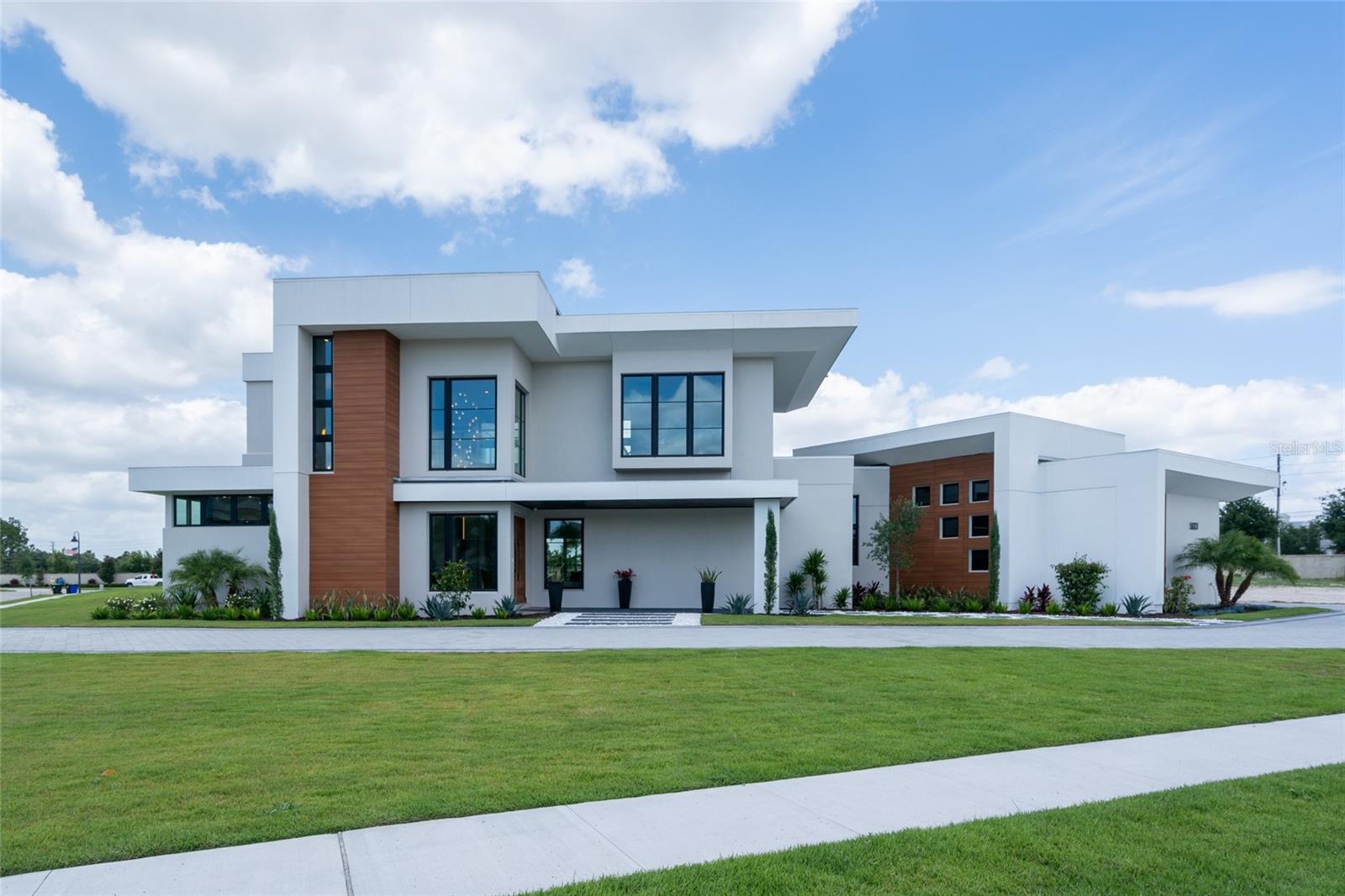 Experience refined modern living at 5023 Sawyer Sound Way, a luxurious home in the exclusive gated community of Sawyer Sound in Windermere. This 5-bedroom, 5.5-bathroom residence features expansive living spaces, an open-concept floor plan, and abundant natural light. Clean lines and warm, textured finishes create a soft, welcoming atmosphere rarely found in modern design. Enjoy a chef’s kitchen, seamless indoor-outdoor living, a private pool, and high-end finishes throughout—all just steps from Windermere Preparatory School, one of Central Florida’s top-rated private institutions.