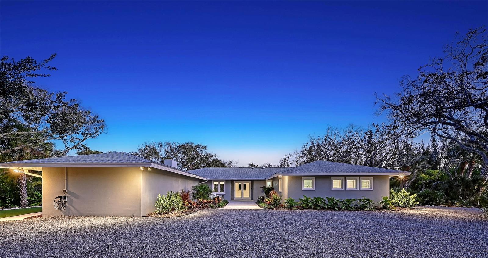 One or more photo(s) has been virtually staged. Location, Privacy, Location, Value, Location. Welcome to the BEST non-Gulf front setting in Sanderling on Siesta Key. This fully updated home sits on a ¾-acre lot with an adjacent co-owned ¾-acre lot, giving you the benefit and privacy of over 1.5 acres on a private island in the middle of Sanderling. It is grandfathered to remain as a one-level home with no steps, allowing you to enjoy it indefinitely as your dream home or design and build a future residence on Plover. Set within the gates of the exclusive Sanderling Club on Siesta Key, this exceptional 3-bedroom, 3.5-bath residence presents a rare opportunity to own in one of the island’s most private and storied coastal communities. The Sanderling is a member-owned Gulf-to-Bay enclave celebrated for its low-density design, lush tropical landscape, iconic banyan canopy, and unparalleled access to Siesta Key’s world-famous quartz sand beach. Residents enjoy boat slips for lease, both clay and hard tennis courts, pickleball courts, clubhouse amenities, and guard-gated security. Beautifully positioned among mature tropical landscaping, the home blends timeless charm with high-quality upgrades and thoughtful improvements. Impact-rated windows and doors provide security, energy efficiency, and peace of mind. A brand-new roof was installed in 2025, and the home is insulated throughout with Isonene foam insulation for excellent climate control and quieter interiors. Inside, the home is warm, bright, and designed for relaxed coastal living. The main living spaces feature abundant natural light and tranquil garden views through large windows and sliders that connect seamlessly to the surrounding greenery. A rare feature for Siesta Key, the living room includes a fully functioning wood-burning fireplace, creating a cozy focal point for cooler winter evenings. The open living and dining areas offer flexible space for entertaining or everyday comfort, while the kitchen provides generous workspace, ample cabinetry, and excellent flow to the surrounding rooms. In addition to the three bedrooms, the home includes a comfortable office ideal for remote work or quiet reading, along with a large walk-in pantry providing exceptional storage and organization. The primary suite is privately situated and offers peaceful views, generous closet space, and an en-suite bath designed for comfort and functionality. Two additional guest suites, each with their own private bathrooms, provide excellent accommodations for family and visitors, while a convenient half bath serves the main living areas. Outdoor living is one of the home’s greatest attributes. Surrounded by mature landscaping and the Sanderling’s natural canopy, the grounds feel serene and secluded. A beautifully installed turf lawn creates a low-maintenance outdoor space ideal for pets, play, or lounging, while a dedicated fire pit area offers the perfect place to gather in the evenings and enjoy the soft Gulf breezes. As a resident of the Sanderling Club, you’ll enjoy access to a members-only beachfront, clubhouse amenities, tennis and pickleball courts, and boat access. The Sanderling Clubhouse renovation has been approved and is underway, further enhancing the community’s already exceptional amenities. This bright and inviting island home is truly a must see, offering an extraordinary combination of privacy, setting, and lifestyle in one of Siesta Key’s most cherished communities.