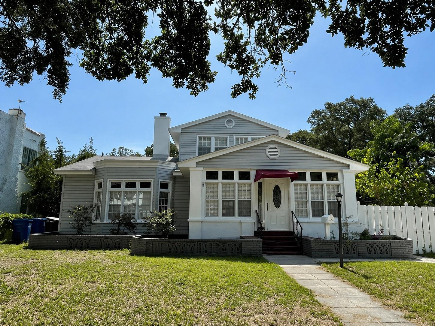 Incredible Investment Opportunity: Historic Uptown 3-Unit Income Property in St. Petersburg....   
Discover a rare, well-maintained vintage gem in the historic Uptown neighborhood along magnificent tree-lined streets. This triad opportunity blends classic charm with modern livability, featuring a spacious main residence plus two income-producing units—each with long-term tenants in place. The main house offers about 2,400 sq ft of living space, with four bedrooms and 2.5 baths, preserved original tile floors greeting you at the entry, tall ceilings, and generously proportioned rooms that radiate old-world charm. A magnificent fireplace anchors the living area, making it ideal for gatherings, while the layout flows gracefully into dining and living spaces filled with natural light. The property sits on a huge lot that showcases a large inground pool. The two back units also provide steady income: upstairs is a one-bedroom, one-bath unit and downstairs is another studio unit, all currently leased to long-term tenants, offering immediate cash flow. This is a true vintage home that has been meticulously cared for, merging original character with modern livability in a location that combines historic appeal with everyday convenience. If you’re seeking a remarkable Uptown find with genuine old-world charm, solid rental income, and a backdrop of tree-lined streets, this property is a must-see. Close to downtown St Petersburg and a short drive to the world renowned Pinellas county Beaches. Reach out today to schedule a tour and explore financing options that maximize this incredible opportunity.