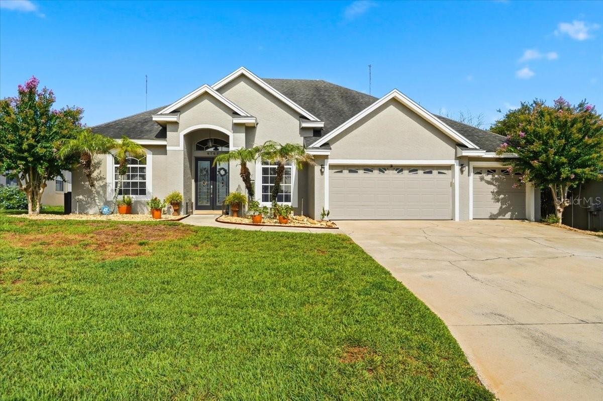 Welcome to this stunning 5-bedroom, 3-bath pool home nestled on nearly a quarter-acre in one of South Lakeland's sought-after gated communities. This thoughtfully designed triple split floor plan offers the perfect blend of elegance, comfort, and functionality.

Step inside to soaring ceilings, beautiful hardwood flooring, crown molding, fresh interior paint, and an abundance of natural light. The spectacular family room is truly the centerpiece of the home, showcasing dramatic floor-to-ceiling windows that overlook the sparkling screened pool and create a bright, open atmosphere.

Designed for both everyday living and entertaining, the spacious kitchen features rich wood cabinetry, stainless steel appliances, a breakfast bar, pantry, and a generous eat-in dining area that flows seamlessly into the family room.

The luxurious primary suite is a private retreat with direct access to the lanai and pool, complemented by a spa-inspired ensuite offering dual vanities, a relaxing garden tub, separate walk-in shower, and a large walk-in closet. The formal living room, family room, and primary suite all open to the screened lanai, creating effortless indoor-outdoor living and beautiful pool views from multiple areas of the home.

The versatile triple split floor plan includes four additional bedrooms, providing flexibility for family, guests, home offices, or hobbies. A private guest suite features its own bath, direct pool access, and added sound insulation, making it ideal for visitors or multigenerational living.

Step outside to your own backyard oasis featuring a screened pool, expansive covered lanai, PVC-fenced backyard, and plenty of space for entertaining or simply relaxing. Recent improvements include a new HVAC system (2025), new pool pump (2025), new pool heater (2025), and fresh interior paint, offering peace of mind for the new owner. A spacious three-car garage provides ample room for vehicles, storage, and recreational equipment.

Ideally located in a desirable gated community close to shopping, dining, medical facilities, and top-rated schools, this exceptional South Lakeland home truly has it all. Schedule your private showing today!