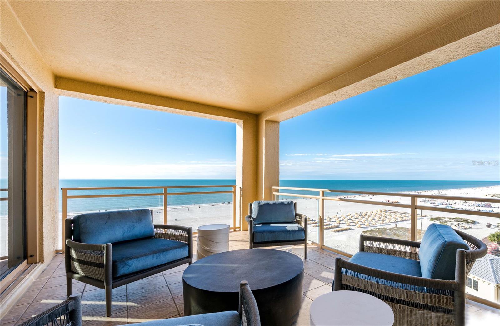COMPLETELY REMODELED - STUNNING DIRECT GULF FRONT Residence at the Sandpearl. This unit has a private BEACH LEVEL CABANA. *** Experience the epitome of luxury living at the Residences at Sandpearl, Tampa Bay's premier condominium, offering breathtaking Gulf views from every bedroom. *** This 7th floor direct Gulf front unit offers 3 BEDROOMS, 3.5 BATHS, ALL EN-SUITE, and 2,605 square feet of elegant living space. Additionally it offers about 300 sqft of outdoor space - 3 different balconies with wide open Gulf views. *** The meticulously crafted interior features beautiful Hickory wood flooring, exquisite in-laid wood trim, and additional accents throughout, including double crown molding on the ceiling in the living area, with elegant colors and modern lighting. *** Features NEWLY RENOVATED chefs kitchen with gorgeous marble-like granite countertops and backsplash, Stainless Steel appliances, a center island, a breakfast bar and a spacious formal dining room. The spacious and welcoming primary suite features its own private balcony, two walk-in closets equipped with custom shelving, and a lavish ensuite bathroom boasting a garden tub and dual vanities. The residence is adorned with HIGH-END FURNITURE and custom REMOTE-CONTROL operated window shades. *** Enjoy the exclusive amenities of the Sandpearl, including a Bermuda pool, spa, cabanas, fitness center, billiards room, and concierge services. Under building parking and air conditioned storage locker included. This secure building provides residents with a 24/7 Concierge, gathering rooms, billiards room, conference room, state of the art fitness center, bike storage, whole-building water softener, and a beachside pool with expansive relaxation and entertainment areas. Recently renovated it features modern luxurious entryway lobby and club room amenities. This property offers the ultimate coastal lifestyle. Experience unobstructed Gulf views, stunning sunsets, and the pristine sands of America's top-rated beach from the comfort of your own home. Don't miss this extraordinary opportunity to own a piece of paradise. This unit has a deeded BEACH LEVEL CABANA (see photo towards the end).