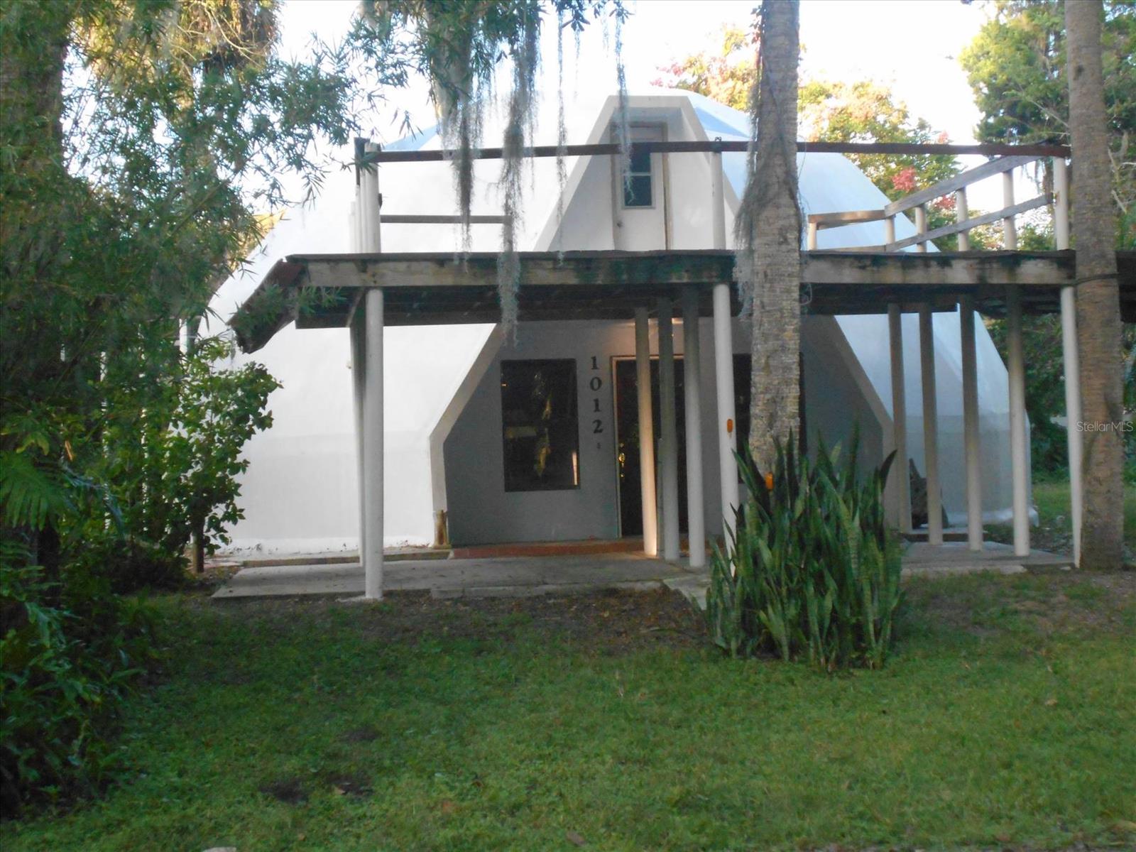 Geodesic Dome with a lake view.  Enjoy cool summer breezes on your deck from the 20 acre lake.  10 minutes from beach.  Close to public schools and college.  Needs remodeling and updating.  Unique opportunity to own a special home and have it customized to your desire.  In its present condition home will probably not qualify for normal financing or insurance.  Seller will consider short term financing with significant down.