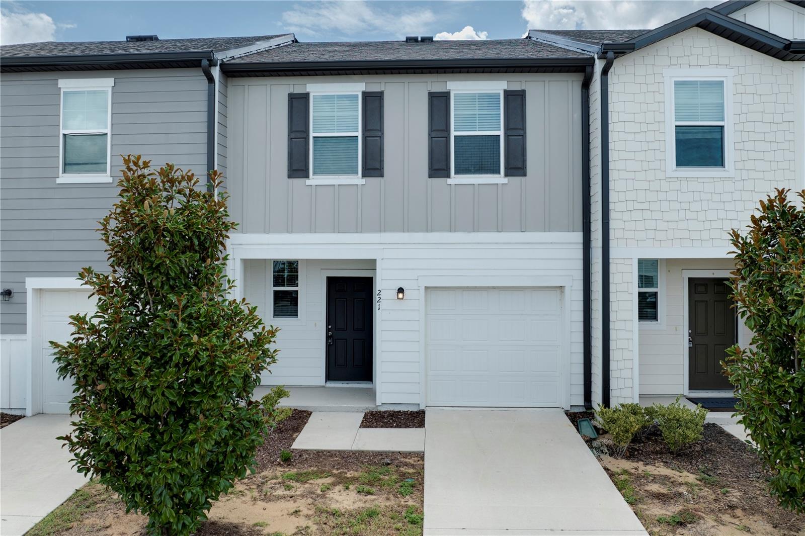 Virtually Staged. Welcome to this beautifully maintained 2023 Starlight Homes townhome in the desirable Madison Place community! This move-in-ready 3-bedroom, 2.5-bath residence offers a thoughtfully designed open floor plan that perfectly blends comfort and functionality. The spacious kitchen is the heart of the home, featuring granite countertops, stainless steel appliances, ample cabinet space, and a large breakfast bar overlooking the bright and inviting living and dining areas-ideal for entertaining or everyday living. Sliding glass doors lead to a private rear patio, providing the perfect space to relax or enjoy your morning coffee. Upstairs, the generous primary suite offers a walk-in closet and an en-suite bath, while two additional bedrooms, a full bathroom, and a conveniently located upstairs laundry room complete the second floor. Enjoy low-maintenance living with exterior landscaping maintained by the HOA, allowing more time to enjoy the community's exceptional amenities, including a resort-style pool, playground, dog park, and scenic walking trails. Ideally located just minutes from US-27 and I-4, this home offers easy access to Champions Gate, Posner Park, Lake Eva Community Park, shopping, dining, entertainment, and Walt Disney World. Whether you're a first-time homebuyer, downsizing, or searching for a investment opportunity, this beautiful townhome is ready to welcome you home.