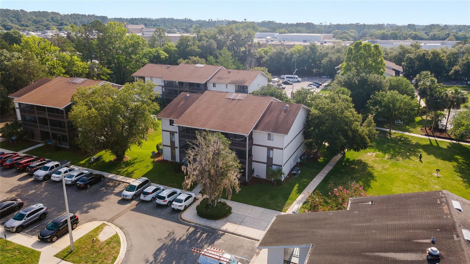 Beautifully updated 1-bedroom, 1-bath condominium featuring a spacious floor plan and an updated kitchen with breakfast bar overlooking the dining area. Enjoy a large living room that opens to a screened porch, perfect for relaxing or entertaining. The oversized primary bedroom offers two closets and plenty of space. Recent upgrades include stylish vinyl wood plank flooring throughout, fresh interior paint, and a new bathroom vanity and mirror. Ideally located just minutes from the University of Florida and Santa Fe College, and within walking distance to Oaks Mall, restaurants, North Florida Regional Medical Center, and convenient access to three bus routes. The community offers fantastic amenities, including a swimming pool, clubhouse, laundry facilities, and fitness center.