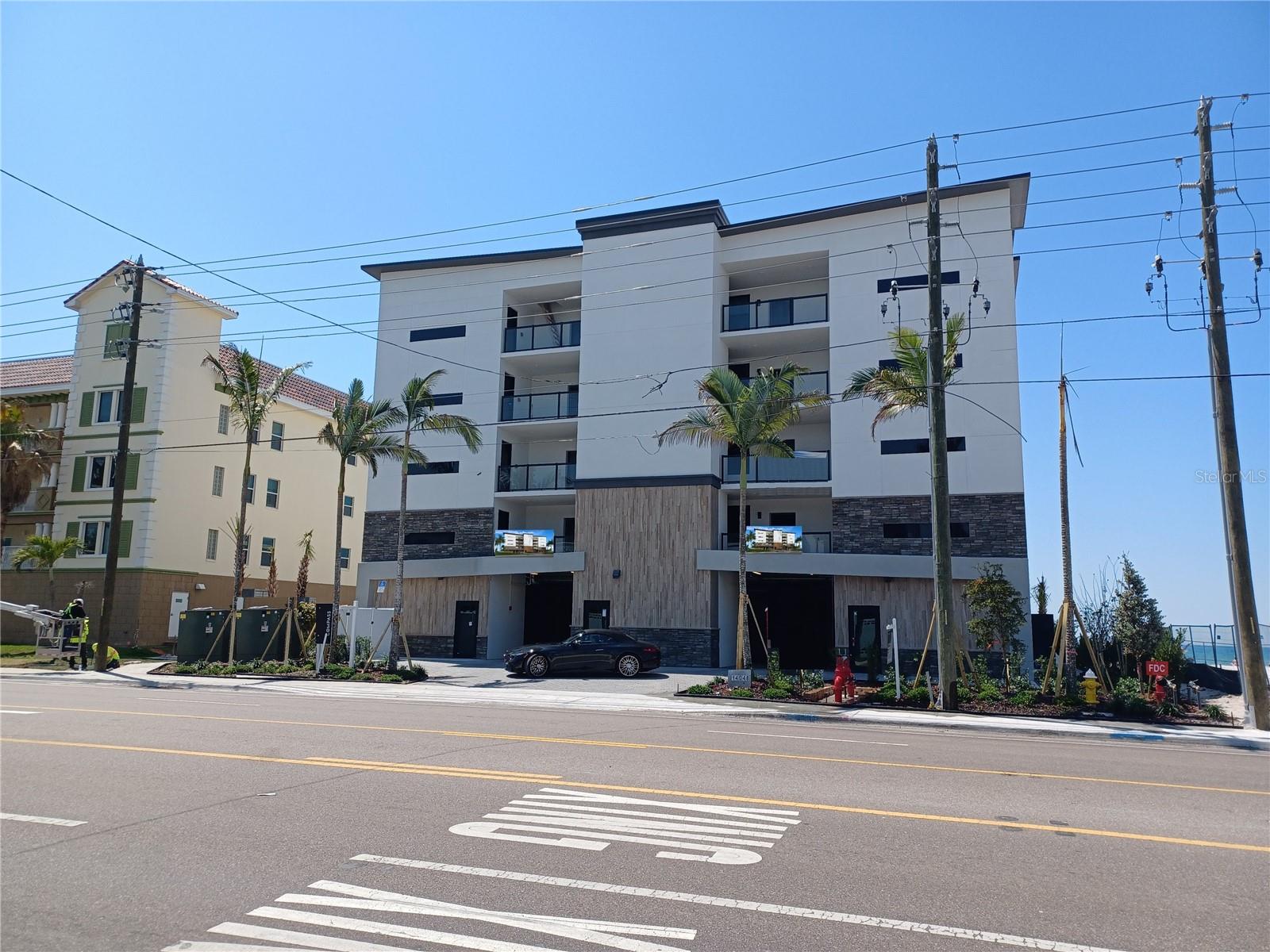 GULF FRONT - Spectacular new building on Madeira Beach. Each unit offers high-end features, an expansive outdoor living area, and direct Gulf views with incredible sunsets. Units starting at $2,625,000. This exquisitely designed building will only have 8 units - 2 units per floor, offering an elevator, pool/spa and under building parking. This unit has 2 bedrooms, 3 baths plus a den. Stainless steel appliances, designer backsplash, high-end cabinetry package for kitchen and bathrooms, solid core doors and premium hardware. Engineered wood flooring with sound mat underlay, luxury carpet in 2nd bedroom and den. Large format tile in Master En-Suite, complete with art-deco accent behind the vanity and custom shower floor design. The second & third bathrooms will include luxury details with tub surround and 6” mosaic tile waterfall accent. Hurricane impact windows and sliders. Large covered outdoor living space (991 sq. ft) will include built-in features and porcelain tile. Beachfront pool and spa with large deck, paver parking lot, landscape package with irrigation system, and exterior lighting. Condo docs available. HOA costs, requirements, leasing, etc to be determined.