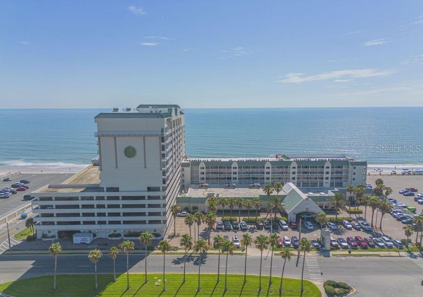Prime Investment Opportunity. This 308 sq ft completely furnished oceanfront condo studio offers great views, new flooring, and income potential. This unit is enrolled in a rental program and is generating transferable passive income while allowing the owner to enjoy personal use whenever they like. The studio features a king bed, a sitting area with a queen sleeper sofa, a kitchenette, and a spacious bathroom. Guests will love the beachfront location, perfect for activities like paddleboarding, surfing, and relaxing on the sand. Located just 1/2 mile from Andy Romano Beachfront Park, it offers easy access to picnic areas, a splash pad, and family-friendly fun. This property is always in demand with nearby dining, shopping, and entertainment. Resort amenities, including indoor and out door pools, sauna, hot tubs, and gym are open. Invest in oceanfront living, your opportunity awaits!