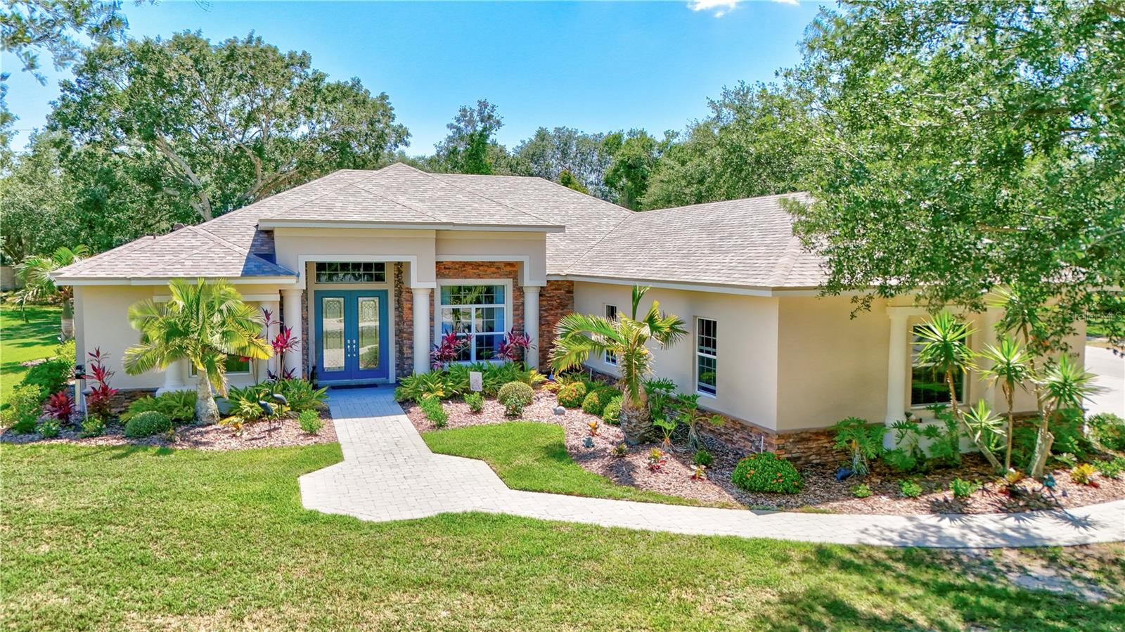 BRING Your toys, Cars, BOAT and RV! Plenty of room with an OVERSIZED 3 car attached garage and a MASSIVE detatched 4 car garage! Spacious Mill Creek Retreat with Dual Garages, Pool & Chef’s Kitchen Almost 3/4 of an acre in a cul-de-sac in the highly desirable Mill Creek community, this beautifully maintained 4-bedroom, 3-bathroom home offers the perfect blend of functionality and space—inside and out. Enjoy the flexibility of an oversized three-car ATTACHED garage plus an oversized two-car DETACHED garage ( Two Driveways) —ideal for your hobbies, workshop, boat, or extra storage. The sparkling pool is the centerpiece of the backyard and can be enjoyed from the comfort of the eat-in kitchen framed by an aquarium glass window. The chef’s kitchen features a large island, double ovens, a wine cooler, a walk-in pantry and additional closet pantry—perfect for entertaining or everyday living. The home’s thoughtful split-bedroom design includes a spacious primary suite with double walk-in closets with custom closet system and private bath. Additional highlights include fresh interior paint, a formal dining room, large laundry room, and an open layout filled with natural light. And with a brand new roof (2025), peace of mind comes standard. Low HOA, no CDD fees, and a serene location make this Mill Creek gem a rare find.