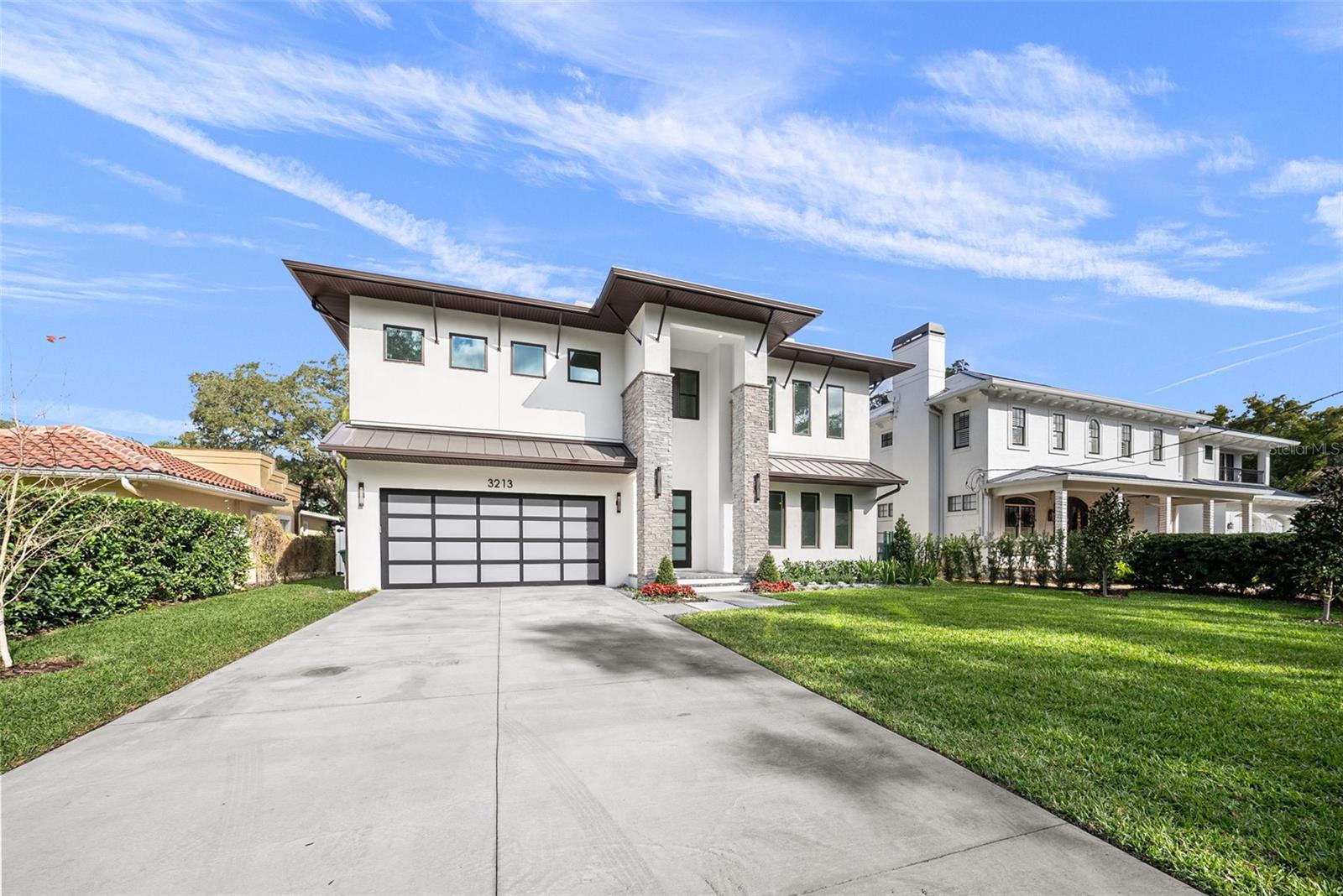 This two-story MODERN style home is located on a VERY DEEP LOT (171 FT) lot on a quiet street in Bayshore Beautiful.
Developed by Javic Homes, this residence features wide planked wood floors in all living areas as well as crown molding. First floor features both a study & guests suite as well as a stunning gourmet kitchen with an island featuring quartz countertops, Sub-Zero and Wolf appliances, gas cooktop, walk-in pantry & large dining area., all overlooking the generous sized Great Room, with an electric linear fireplace & large sliding doors opening up to the generous sized patio. Upstairs you will find three secondary bedrooms suites, all with walk-in closets + a large bonus room.. The master retreat enjoys a tray ceiling, en- suite bath with double vanities, free-standing tub & walk-in shower, and a huge walk-in closet. Your laundry room features a built-in cabinets & quartz countertop for added storage & folding space and a sink as well. Enjoy the outdoor living space with heated saltwater Pool & Spa, fully fenced back yard, relaxing & entertaining space on your covered, pavered lanai with outdoor kitchen including gas grill & beverage fridge. Other features: Contemporary 3 car garage with epoxy floors & frosted impact glass door, interior smooth walls, tankless gas water heater, security system, irrigation system, and so much more. Located in the Roosevelt, Coleman & Plant district, and near to many local restaurants. No flood insurance required!