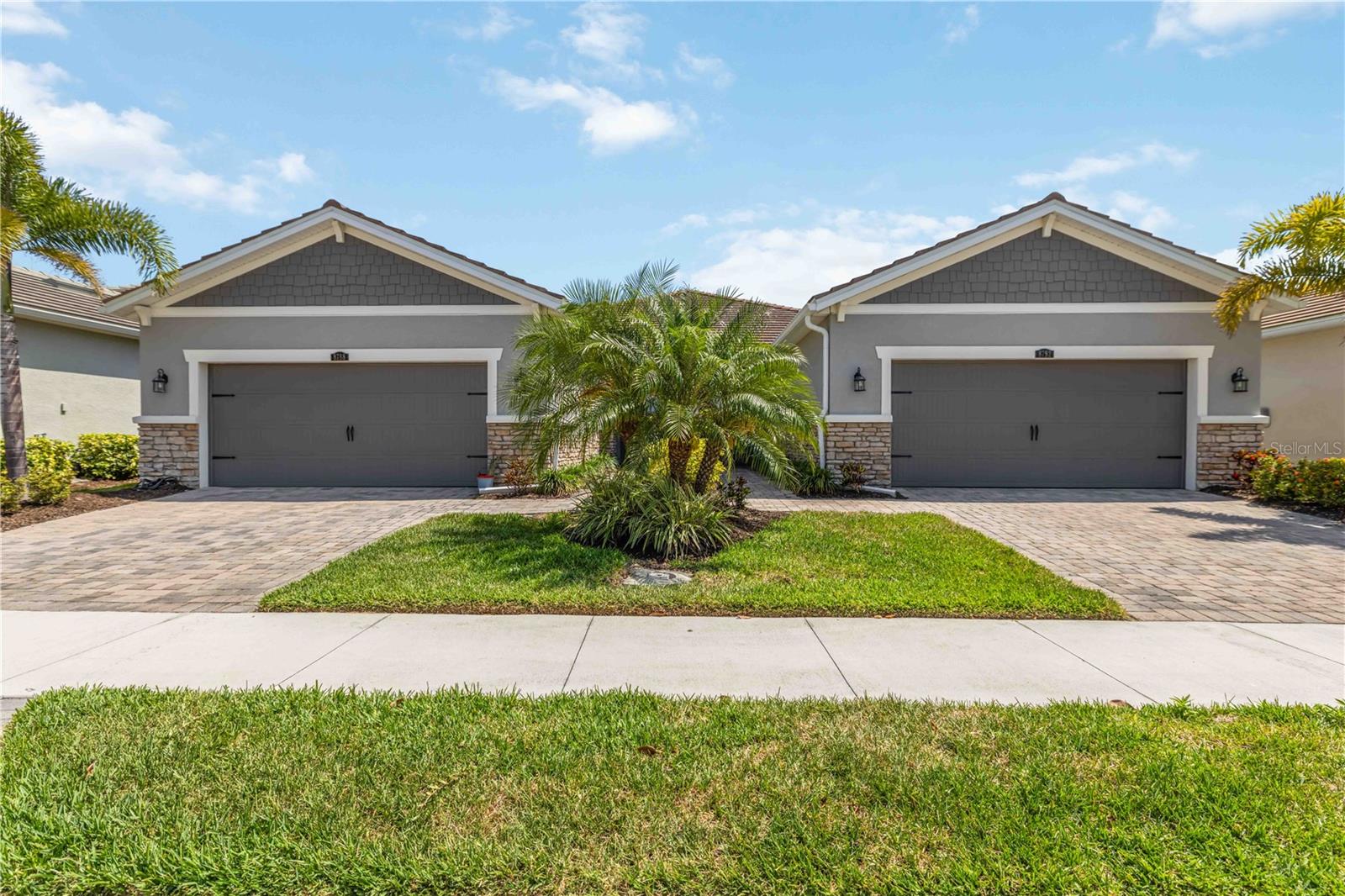 Welcome to effortless Florida living in this beautifully designed Seascape floor plan offering 2 bedrooms, 2 baths, plus a versatile study. The open-concept layout features stylish 7x22 tile flooring throughout the main living areas and plush carpet in the bedrooms for added comfort. The spacious kitchen is a standout with stone-colored cabinetry, elegant Minuet Viatera quartz countertops, stainless steel appliances, and an oversized island—perfect for meal prep, casual dining, or entertaining. The dining area sits conveniently nearby, creating a seamless flow for gatherings. The bright and airy Great Room opens to the extended lanai through glass sliders, inviting in natural light and blending indoor and outdoor living—ideal for enjoying Florida’s breezy evenings. The owner’s suite is a relaxing retreat with abundant light, a large walk-in closet, dual sink vanity, and a walk-in shower with built-in seating. A private secondary bedroom and full bath at the front of the home offer comfort for guests. Additional features include 8-foot interior doors, an Ecobee smart thermostat, and thoughtful upgrades throughout. Located in the vibrant Sunrise community, residents enjoy resort-style amenities including tennis, pickleball, bocce ball, a state-of-the-art clubhouse with fitness center, gathering spaces, and a stunning pool area. A perfect blend of comfort, style, and lifestyle—don’t miss this opportunity.